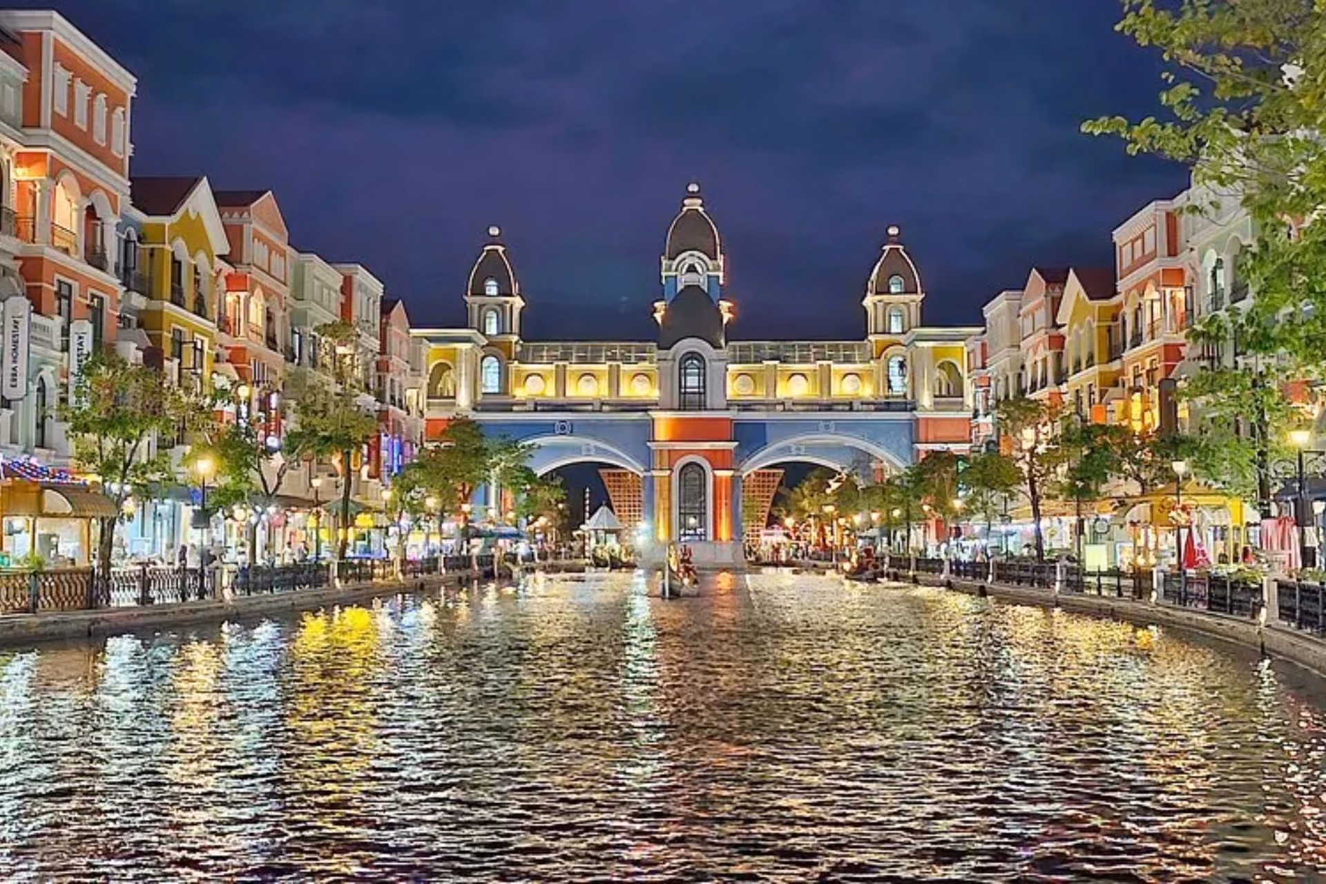 Grand World night scene with canal and colorful buildings