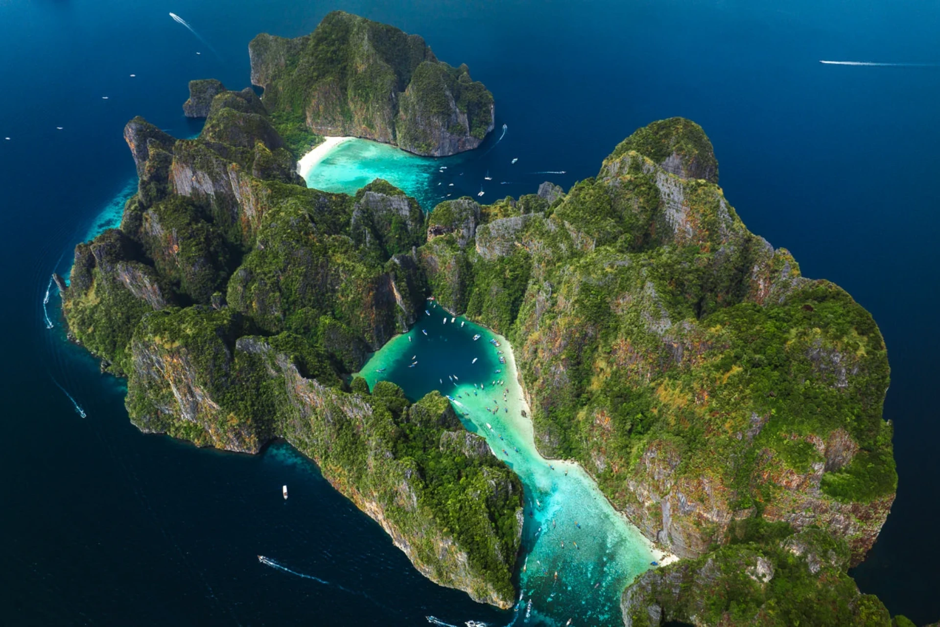 Pileh Lagoon with clear blue-green water surrounded by steep cliffs