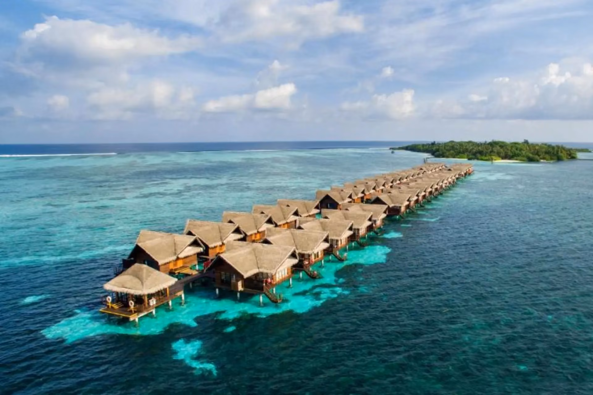 Adaaran Select water bungalows lined up in clear blue water