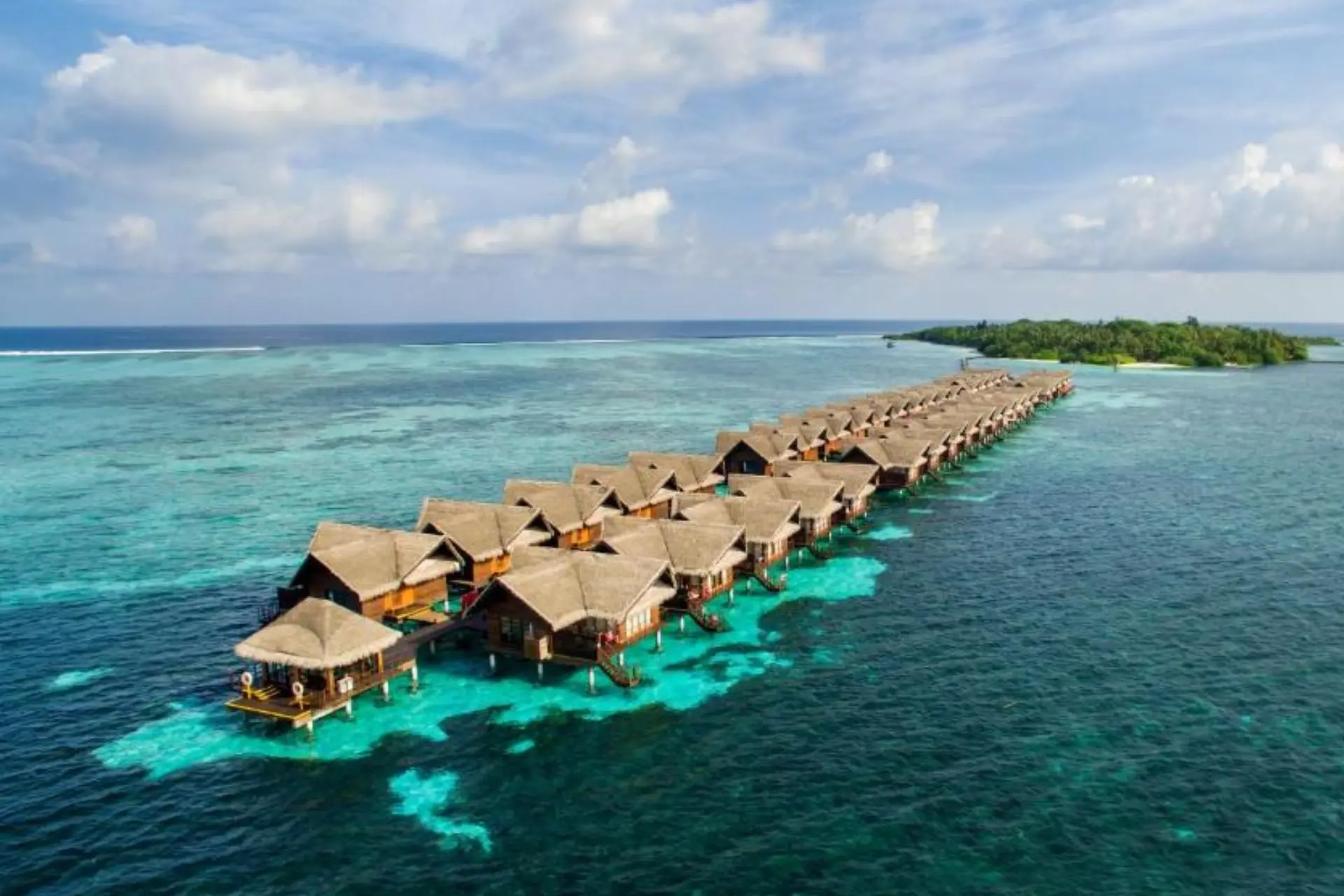 Adaaran Select water bungalows lined up in clear blue water
