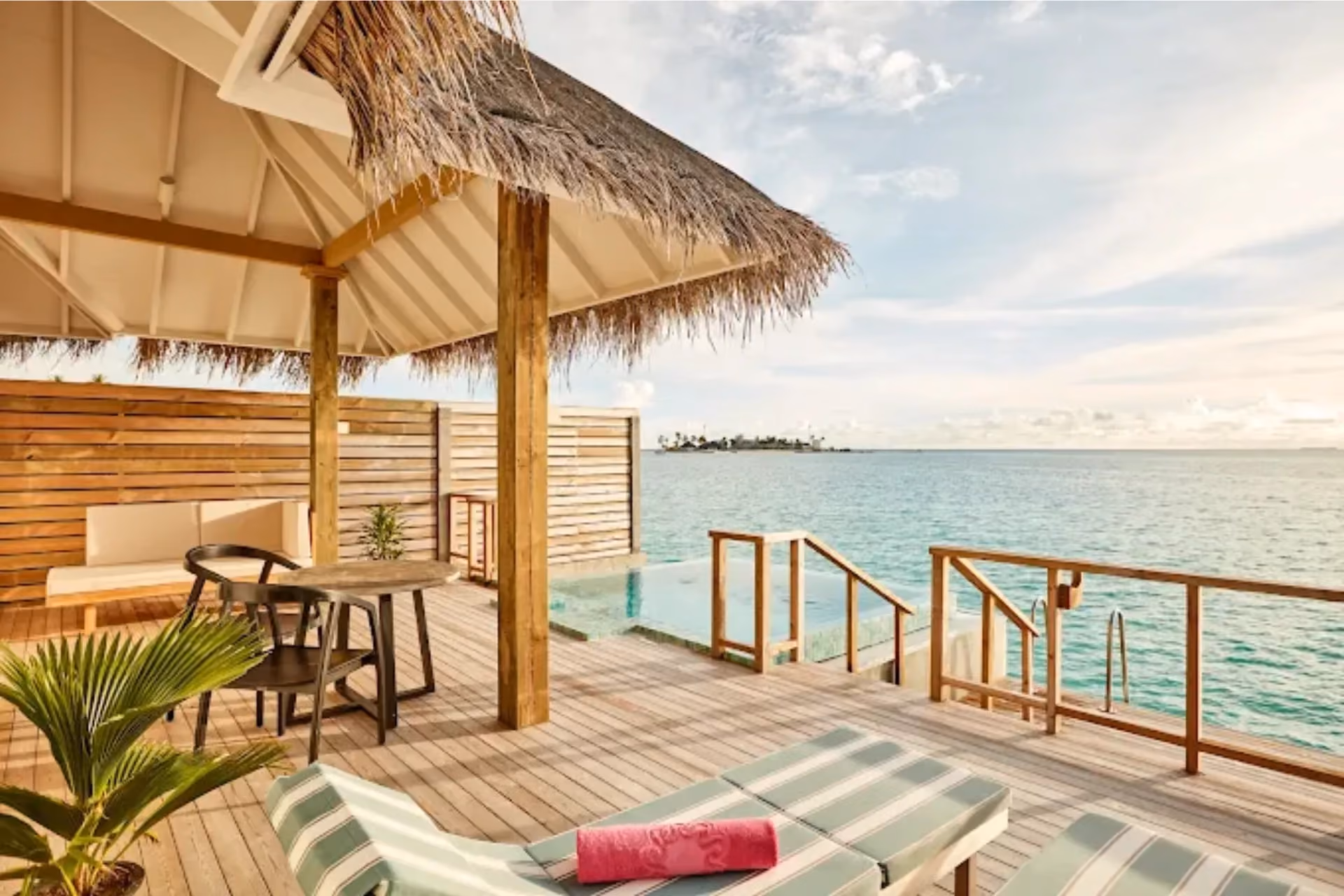 Sun Siyam Iru Veli private deck with ocean view and loungers