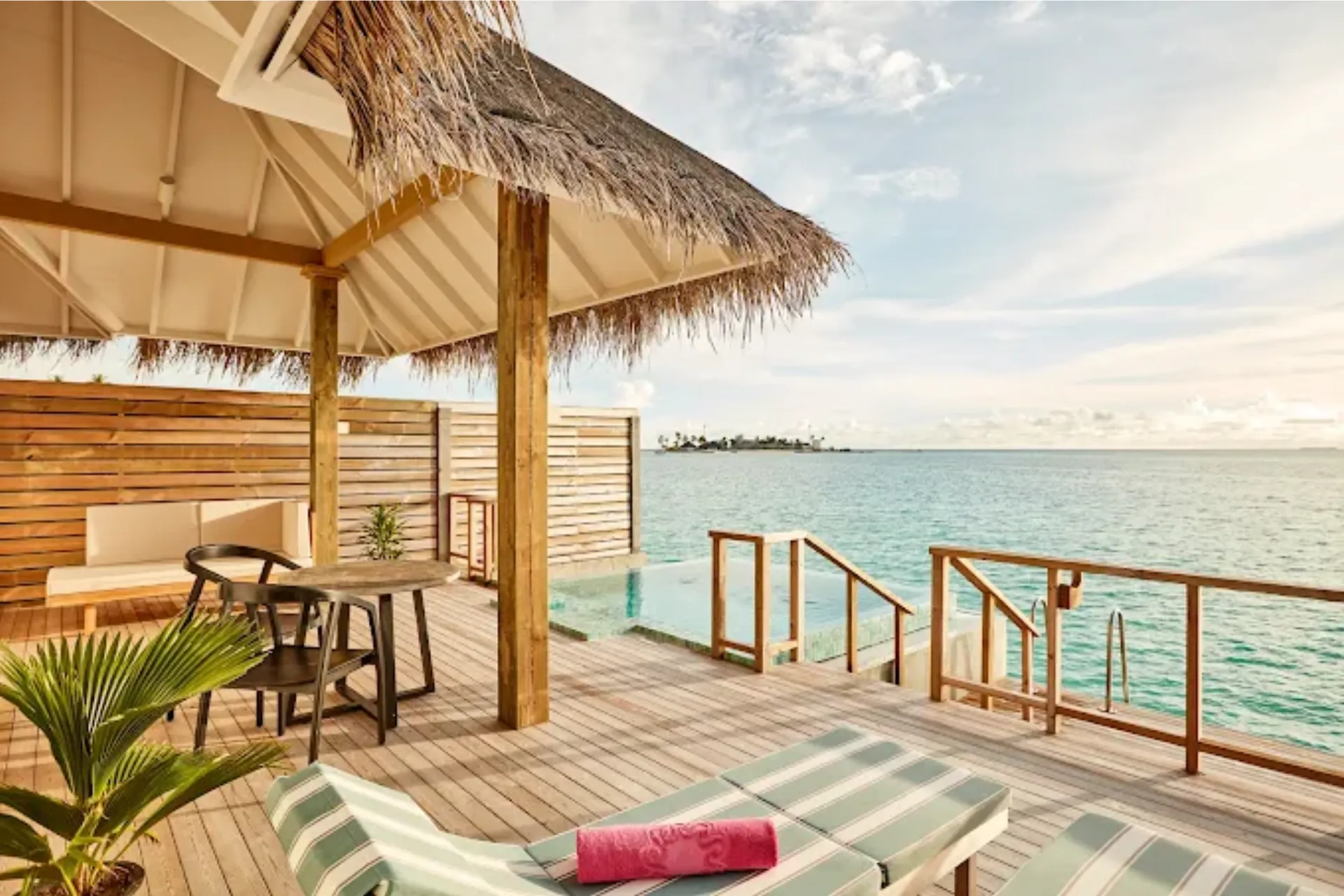 Sun Siyam Iru Veli private deck with ocean view and loungers