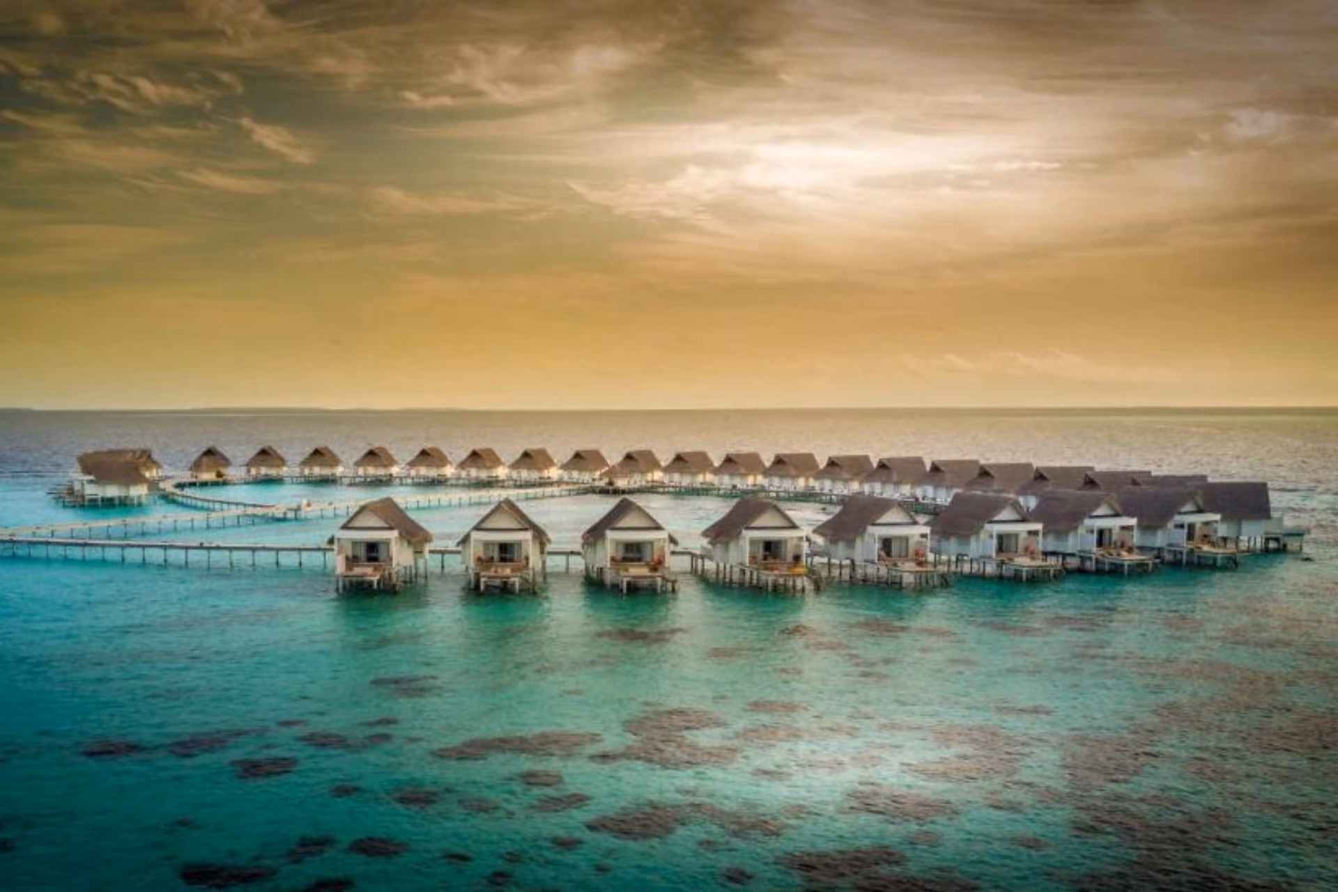 Centara Grand overwater bungalows in clear blue-green water