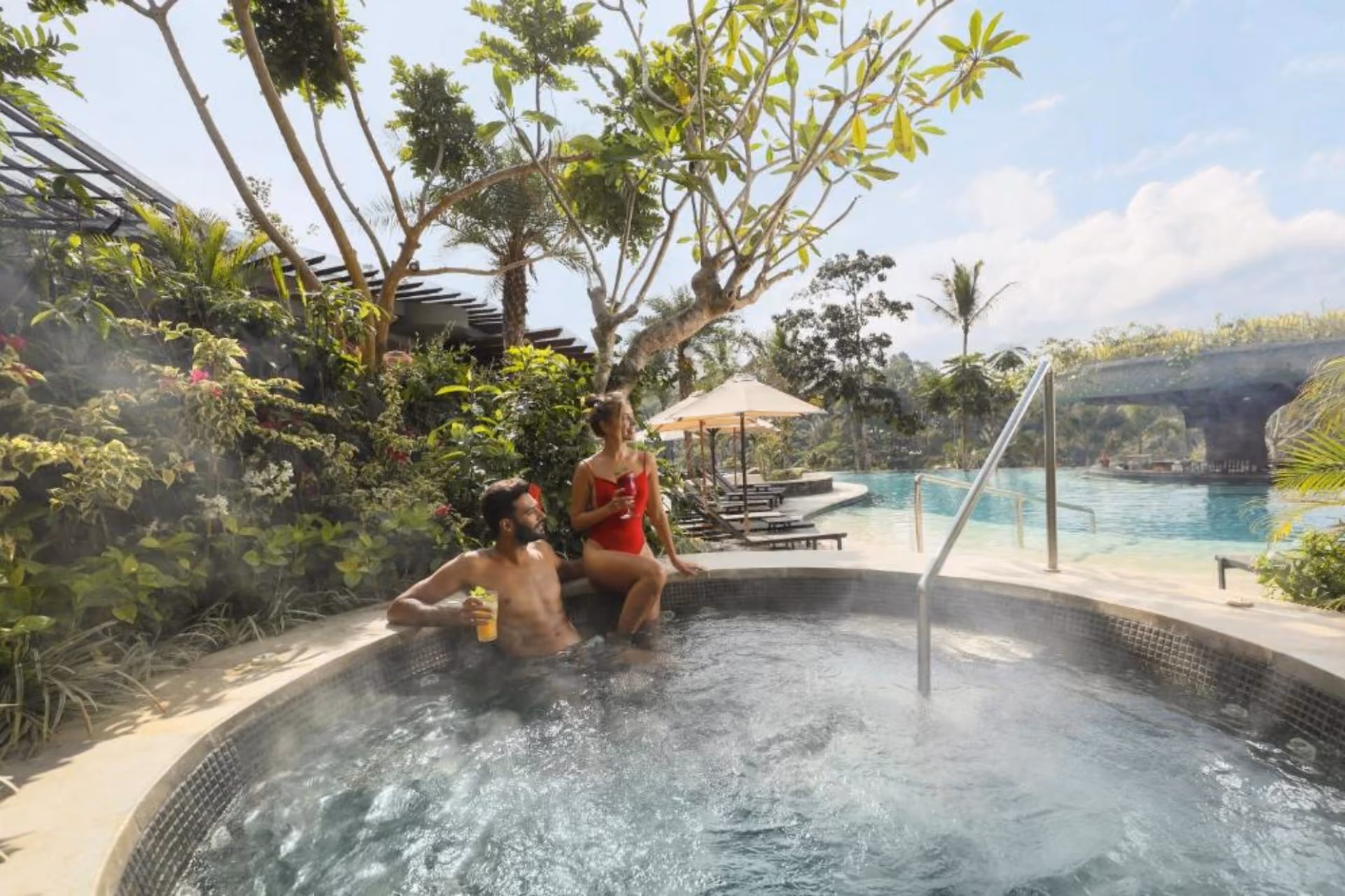 Couple relaxing in hot spring pool at Padma Resort Ubud