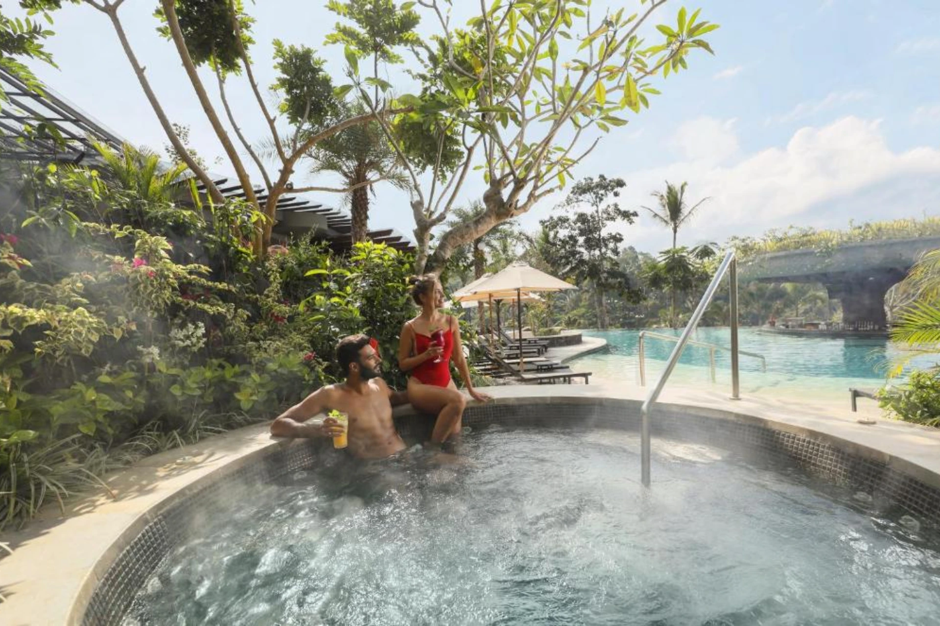 Couple relaxing in hot spring pool at Padma Resort Ubud