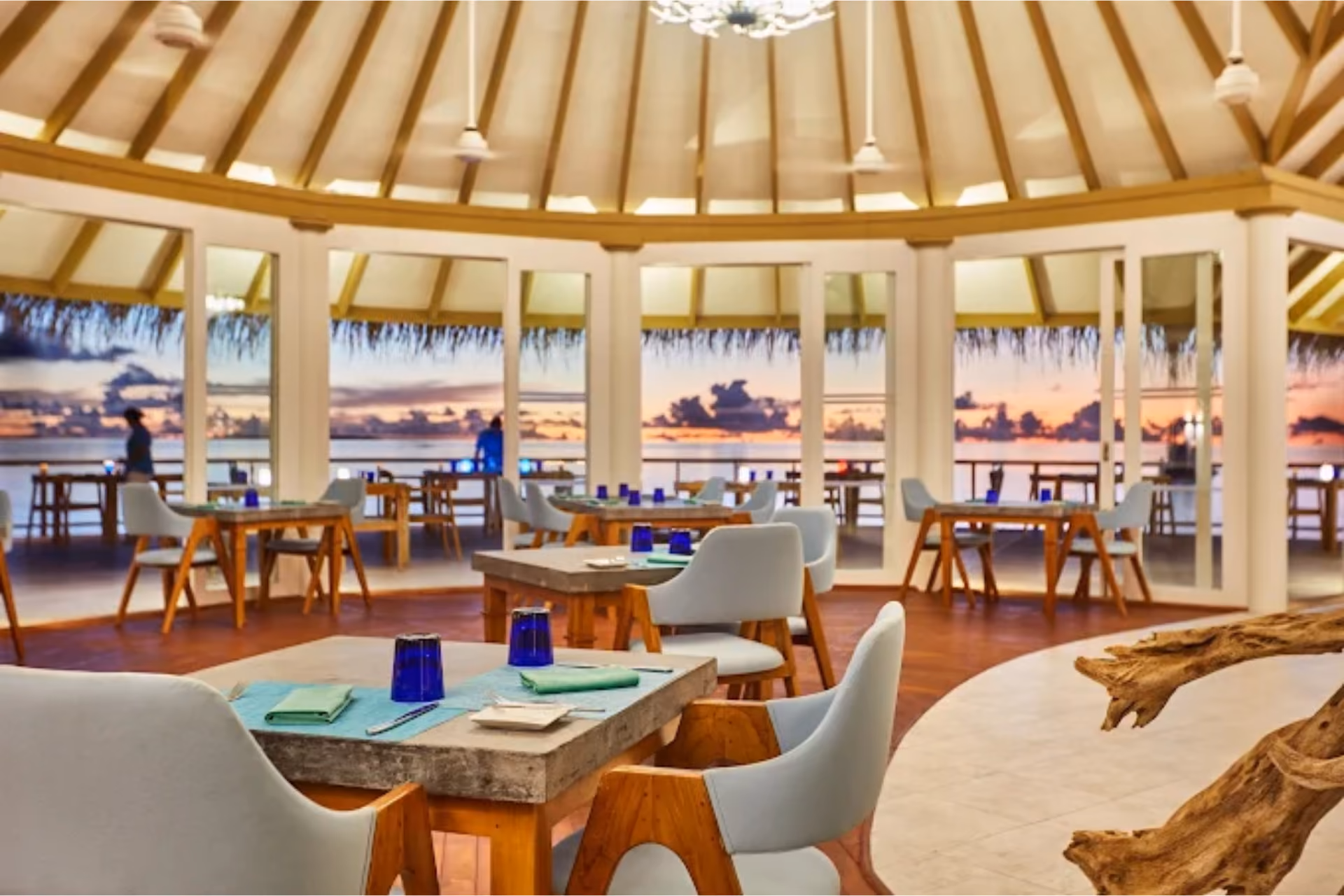 Sun Siyam Iru Veli restaurant with sunset view over water