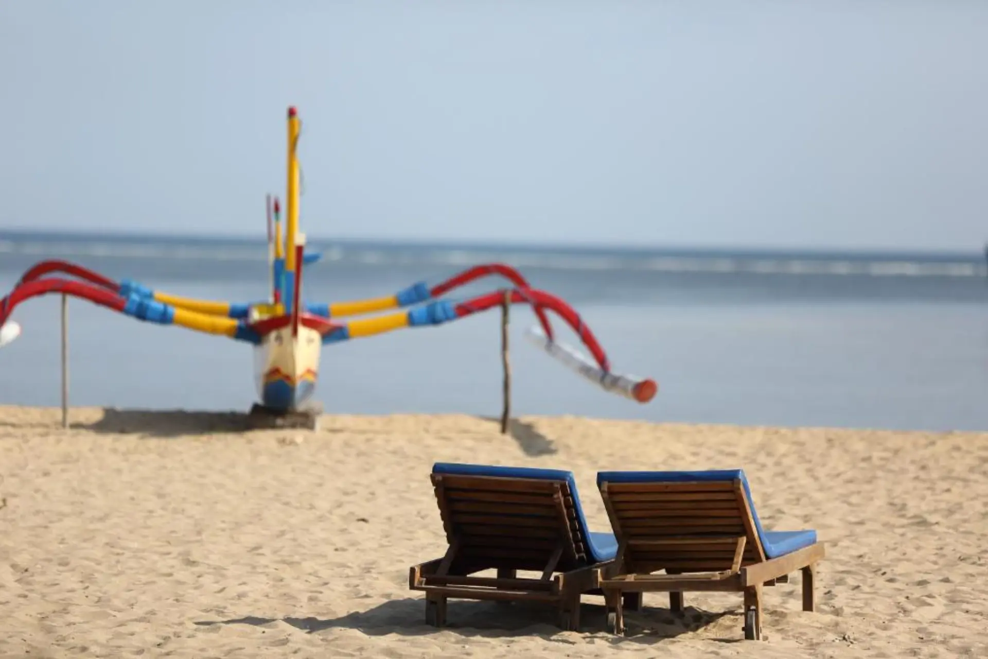 Two beach chairs facing the ocean at Sudamala Resort