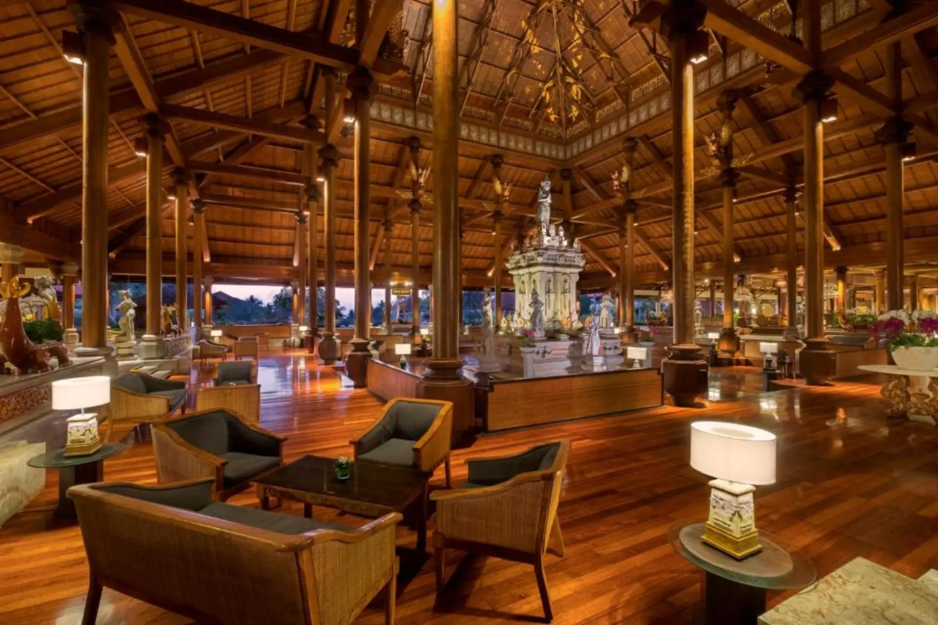 Ayodya luxury resort lobby with wooden beams and statue