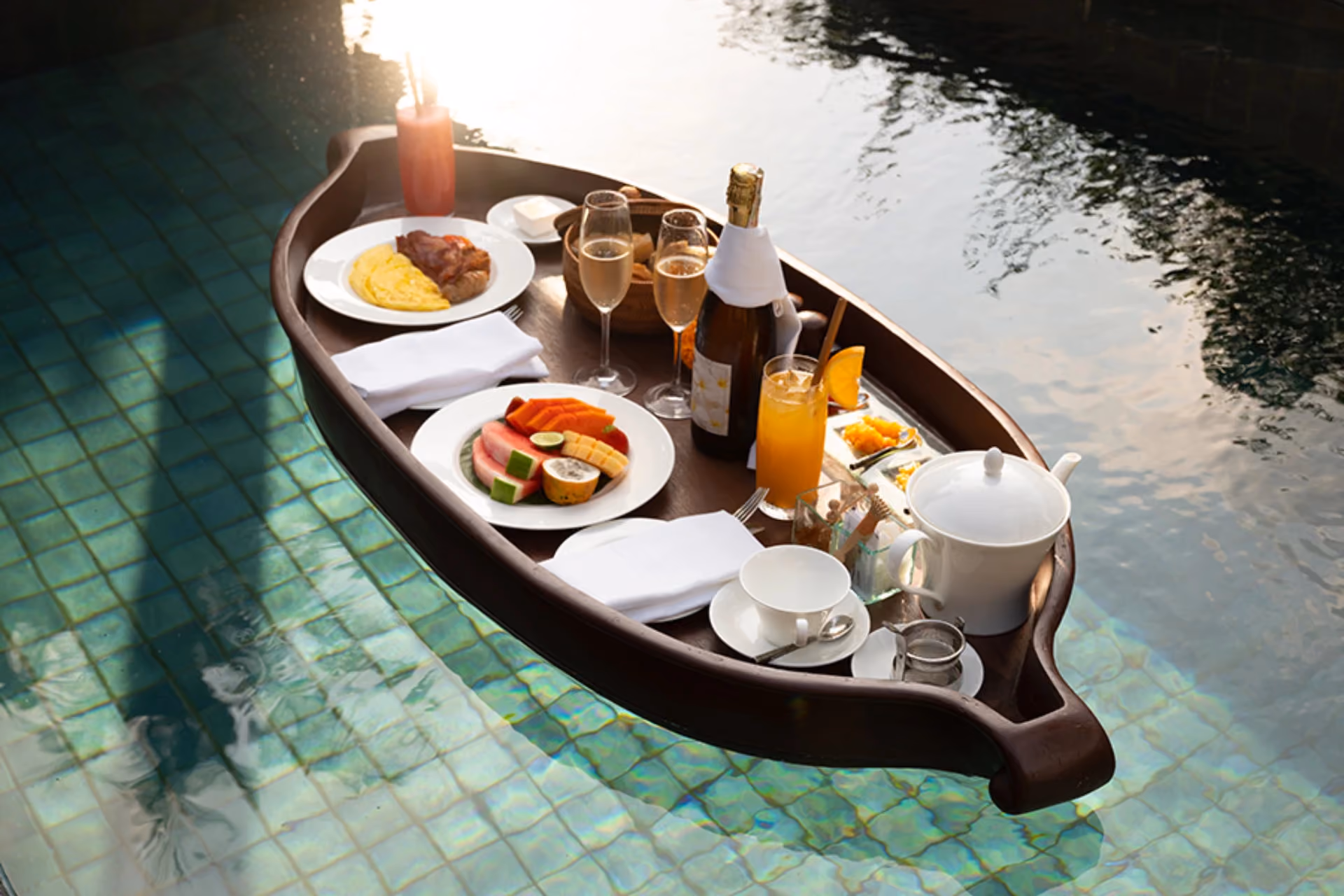 Boat with breakfast food floating in clear water