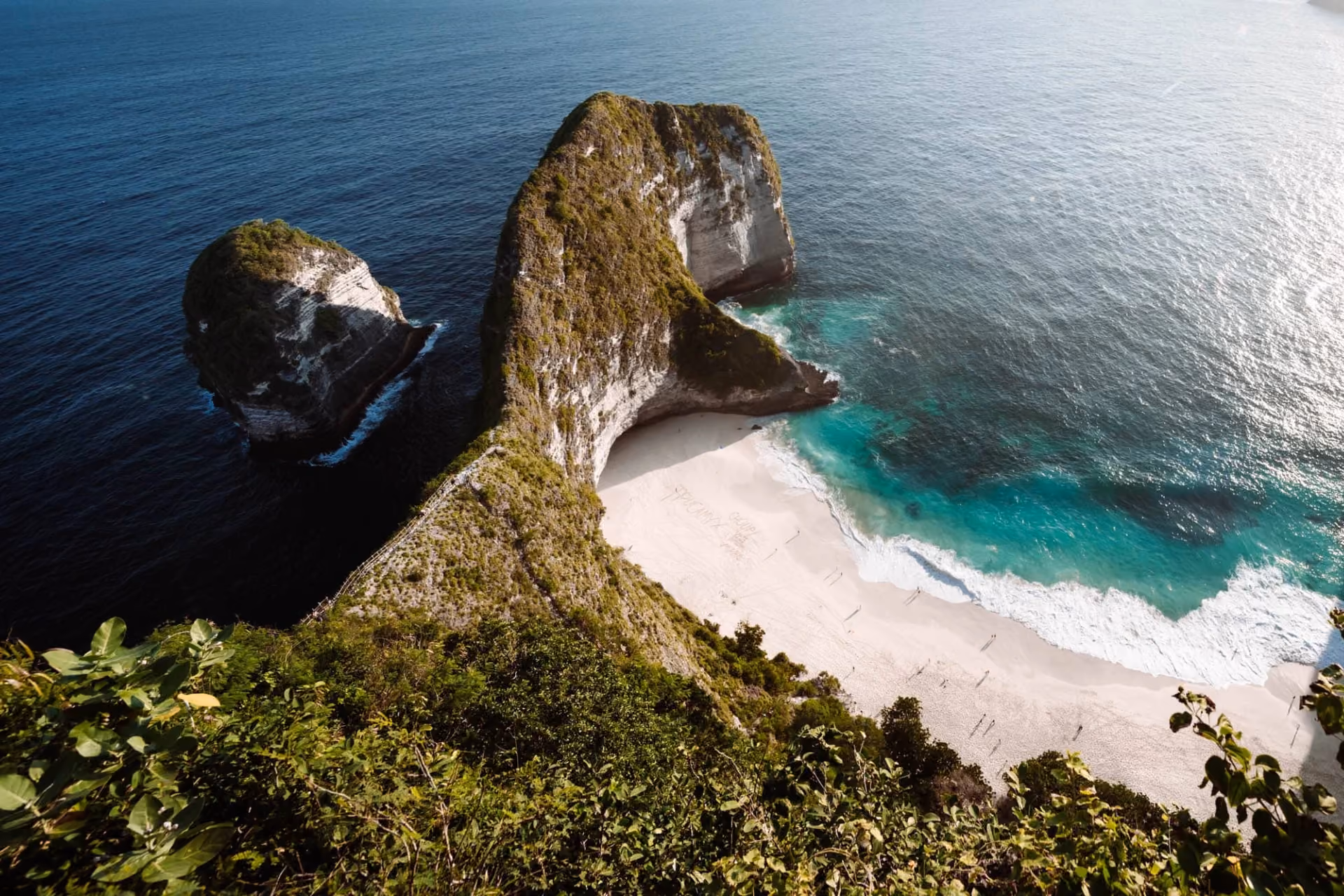 Nusa Penida rocky cliffs with white sand beach below