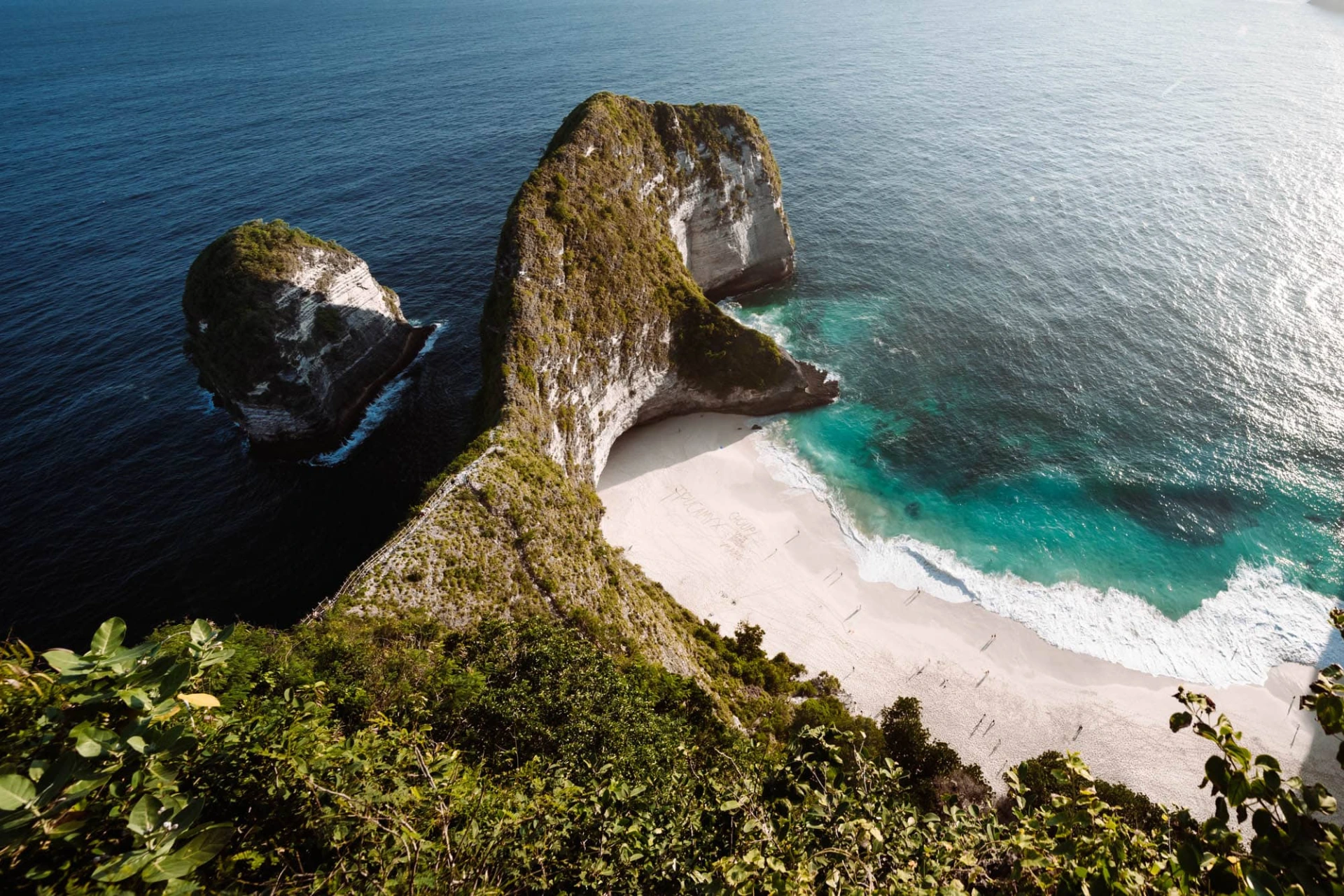 Nusa Penida rocky cliffs with white sand beach below