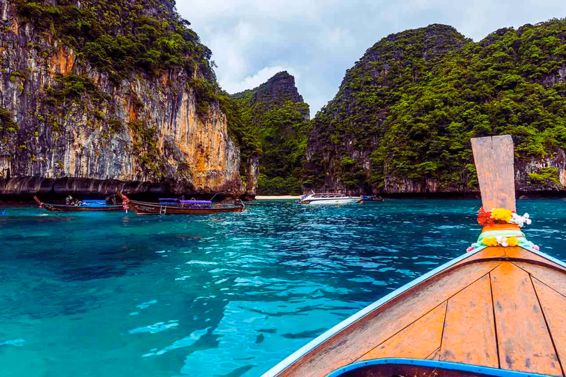 Traditional boat view of Phi Phi Islands limestone cliffs