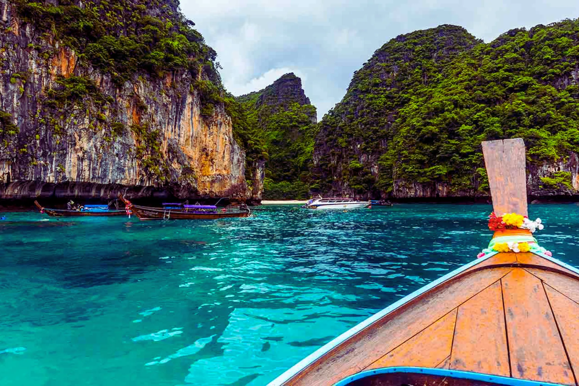 Traditional boat view of Phi Phi Islands limestone cliffs