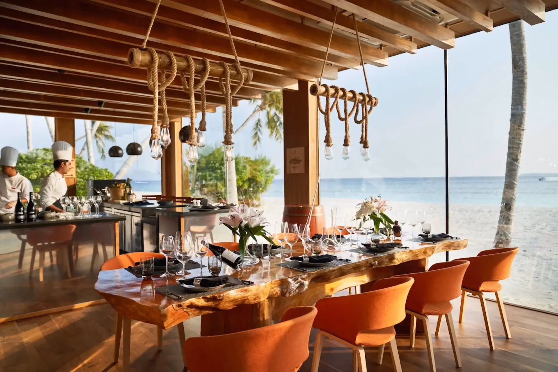 Siyam World beachfront dining room with ocean view and rope lighting