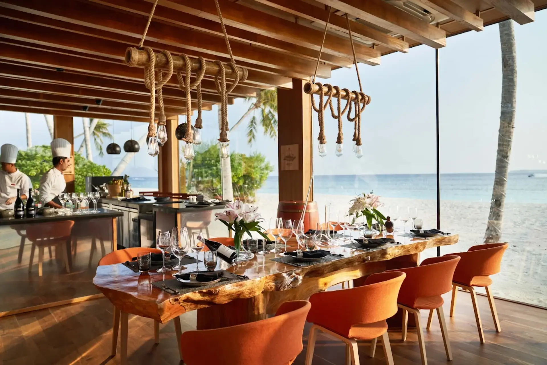 Siyam World beachfront dining room with ocean view and rope lighting