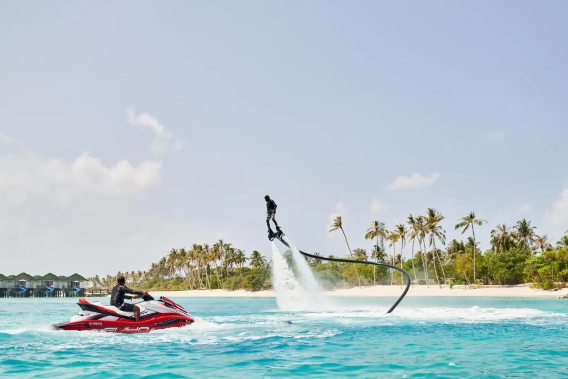 Person on jetpack flying above water at Siyam World