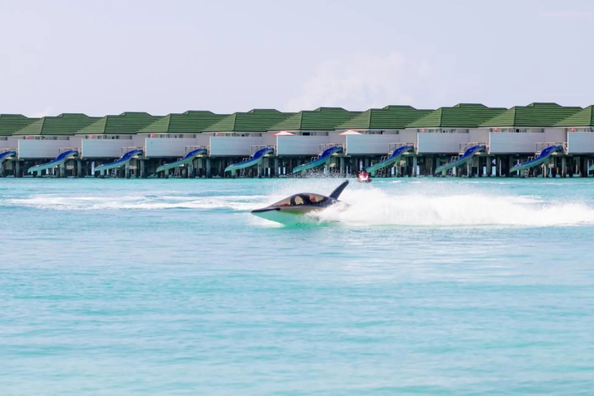 Surfer riding wave at Siyam World water park