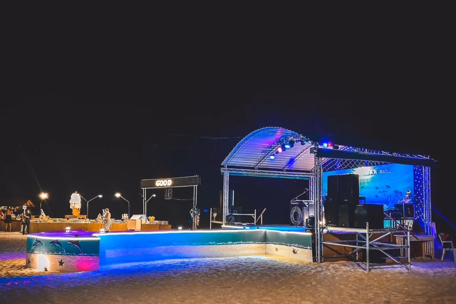Adaaran Rannalhi beach party with blue lights and stage at night