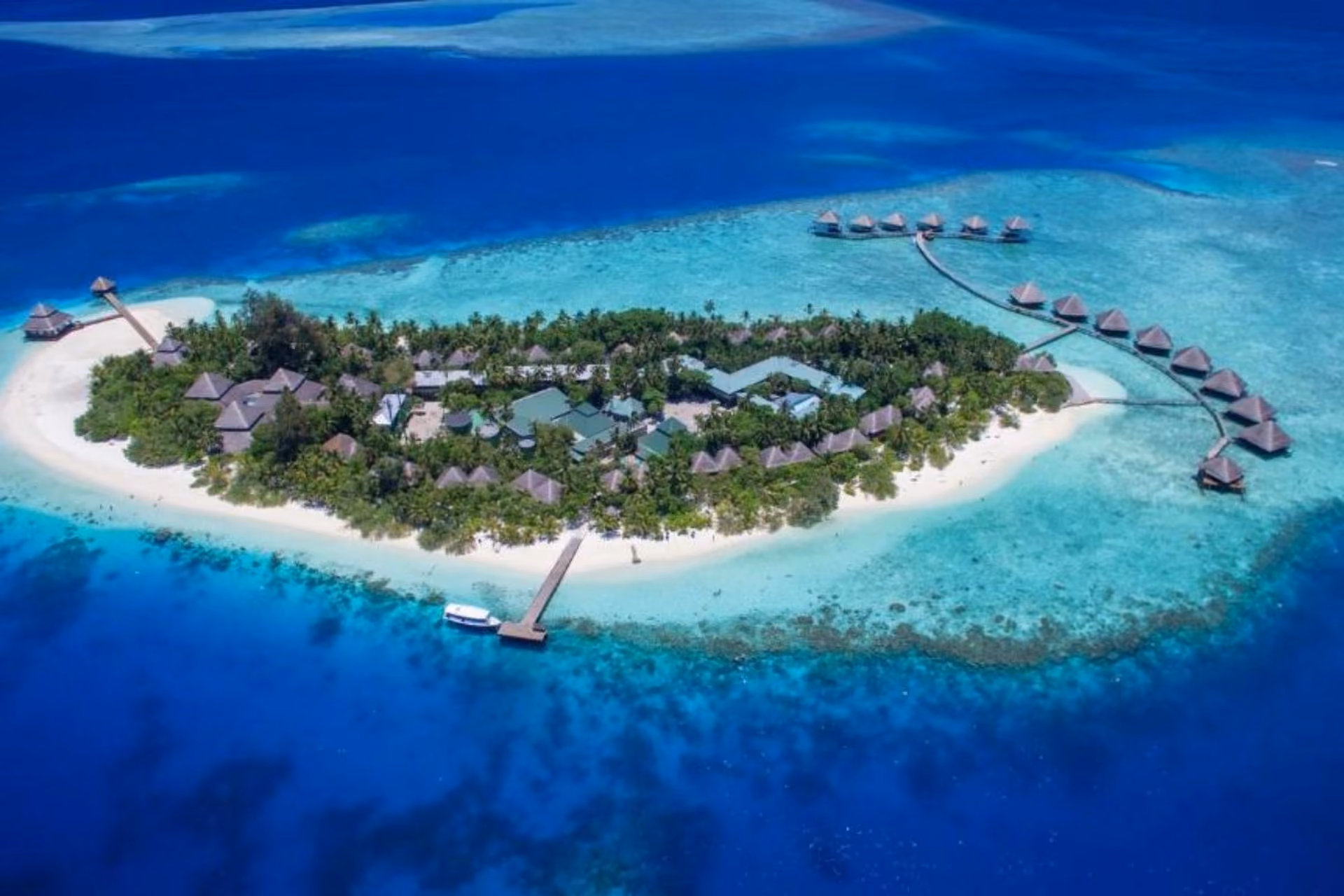 Adaaran Rannalhi island resort with beach huts and water bungalows