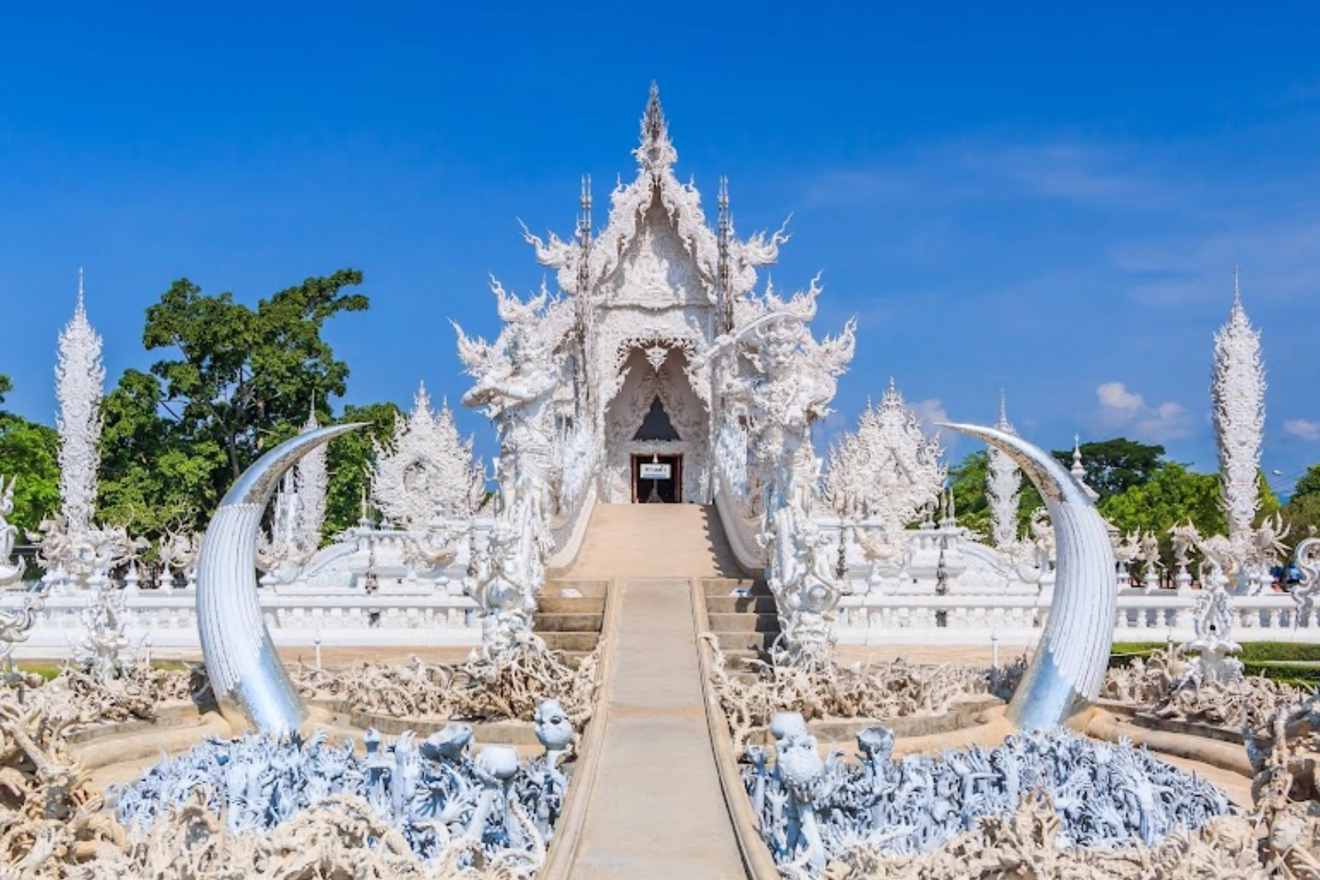 White Temple in Chiang Rai with curved white structures
