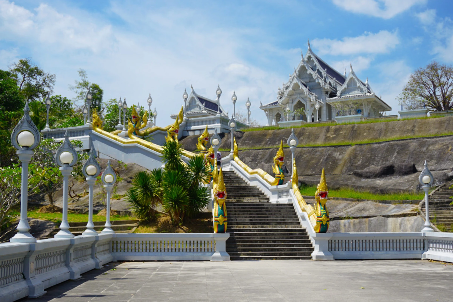 White staircase with gold dragons leading to Wat Kaew temple Krabi
