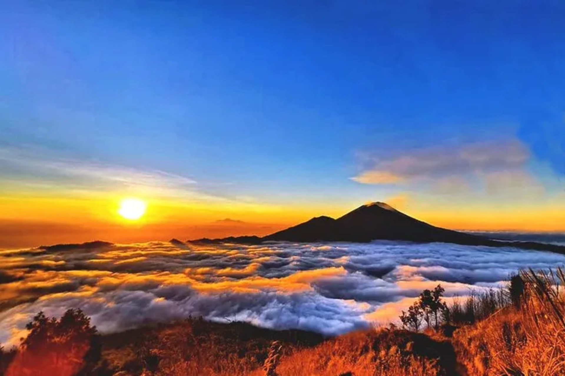 Sunrise over clouds at Mt Batur volcano Indonesia