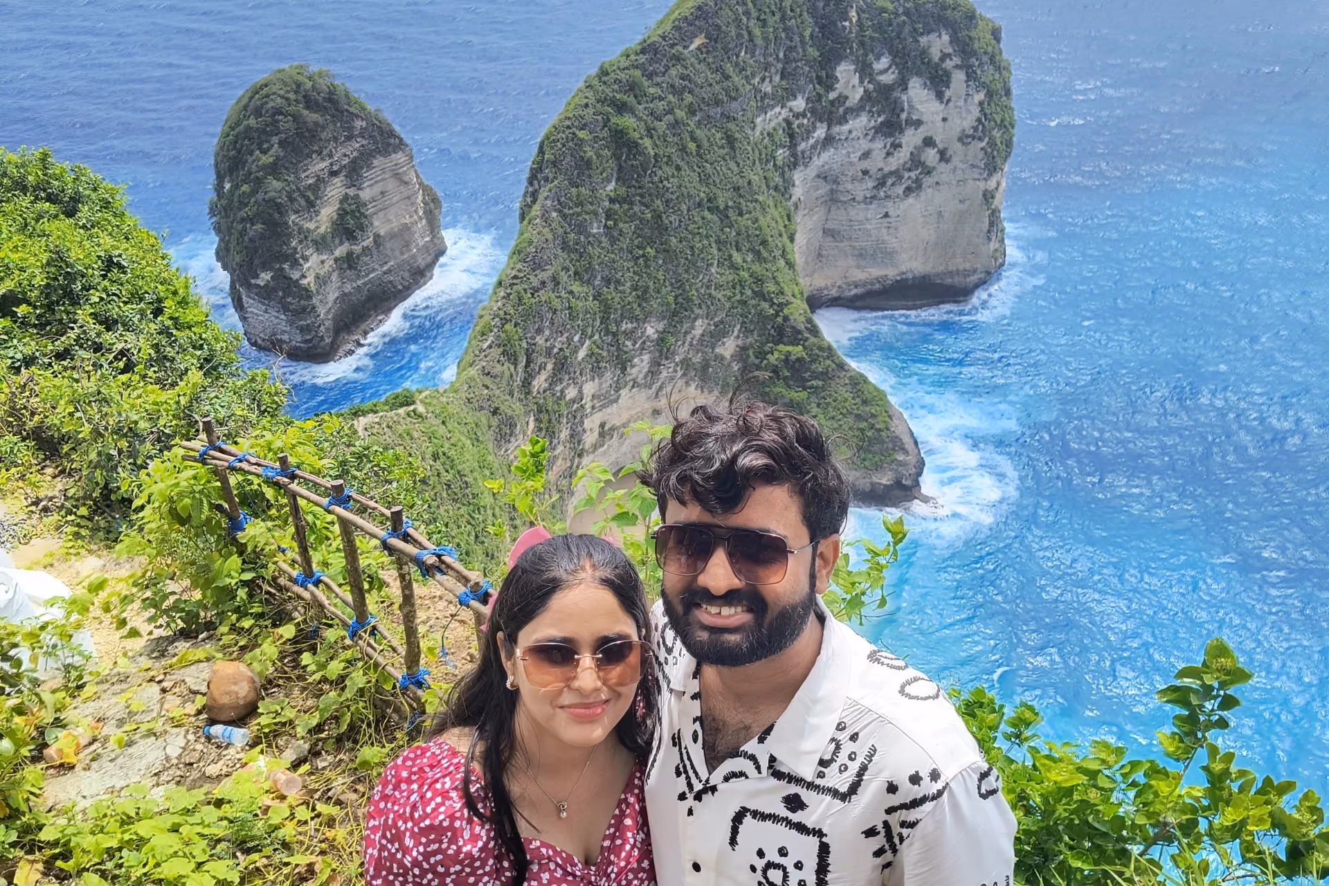 Couple smiling at Kelingking Beach Nusa Tenggara Barat