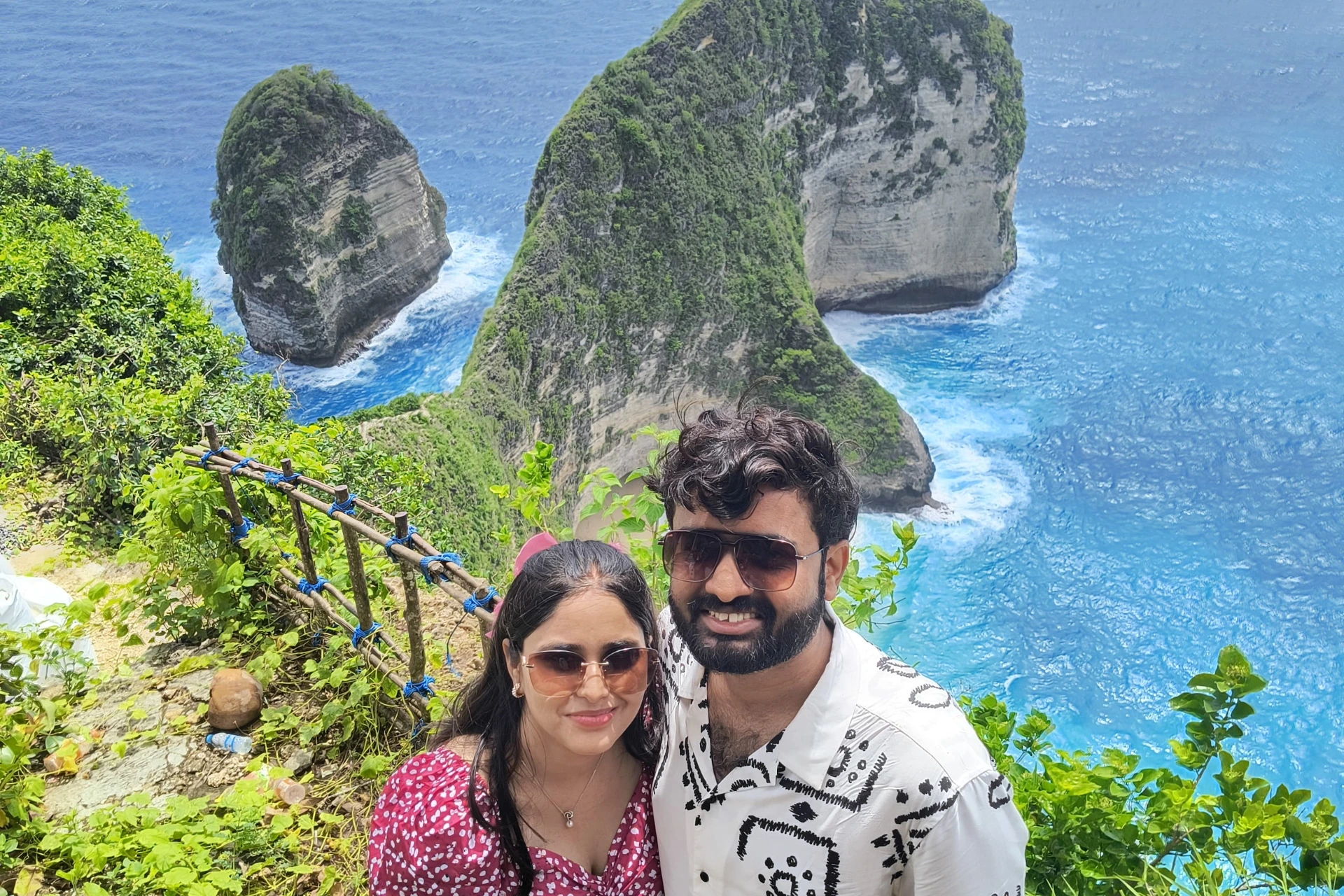 Couple smiling at Kelingking Beach Nusa Tenggara Barat