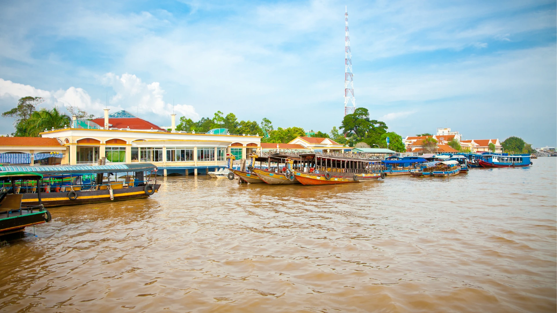 Colorful boats on muddy water at Mekong My Tho Vietnam
