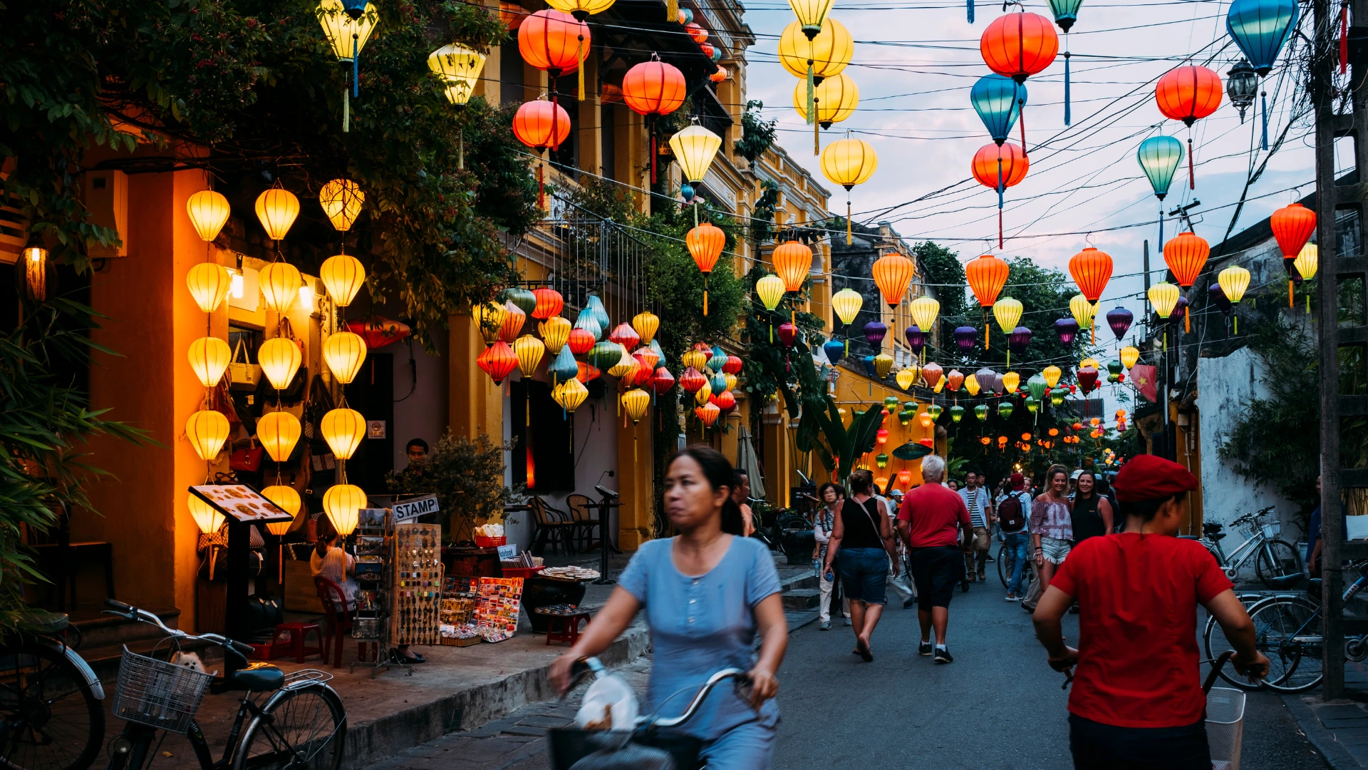 Hoi An street decorated with colorful paper lanterns at dusk