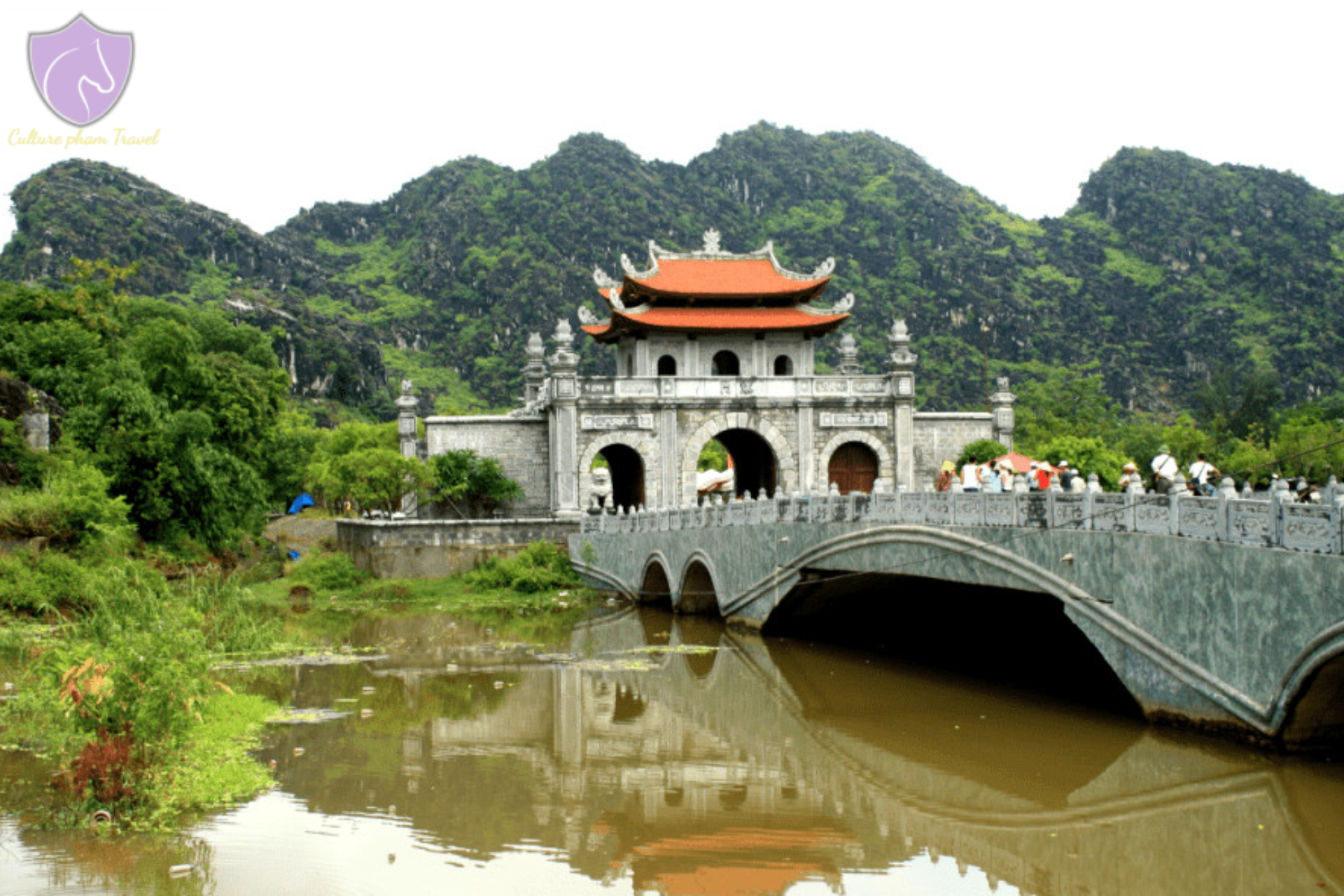 Stone gate with orange roof at Hoa Lu Vietnam