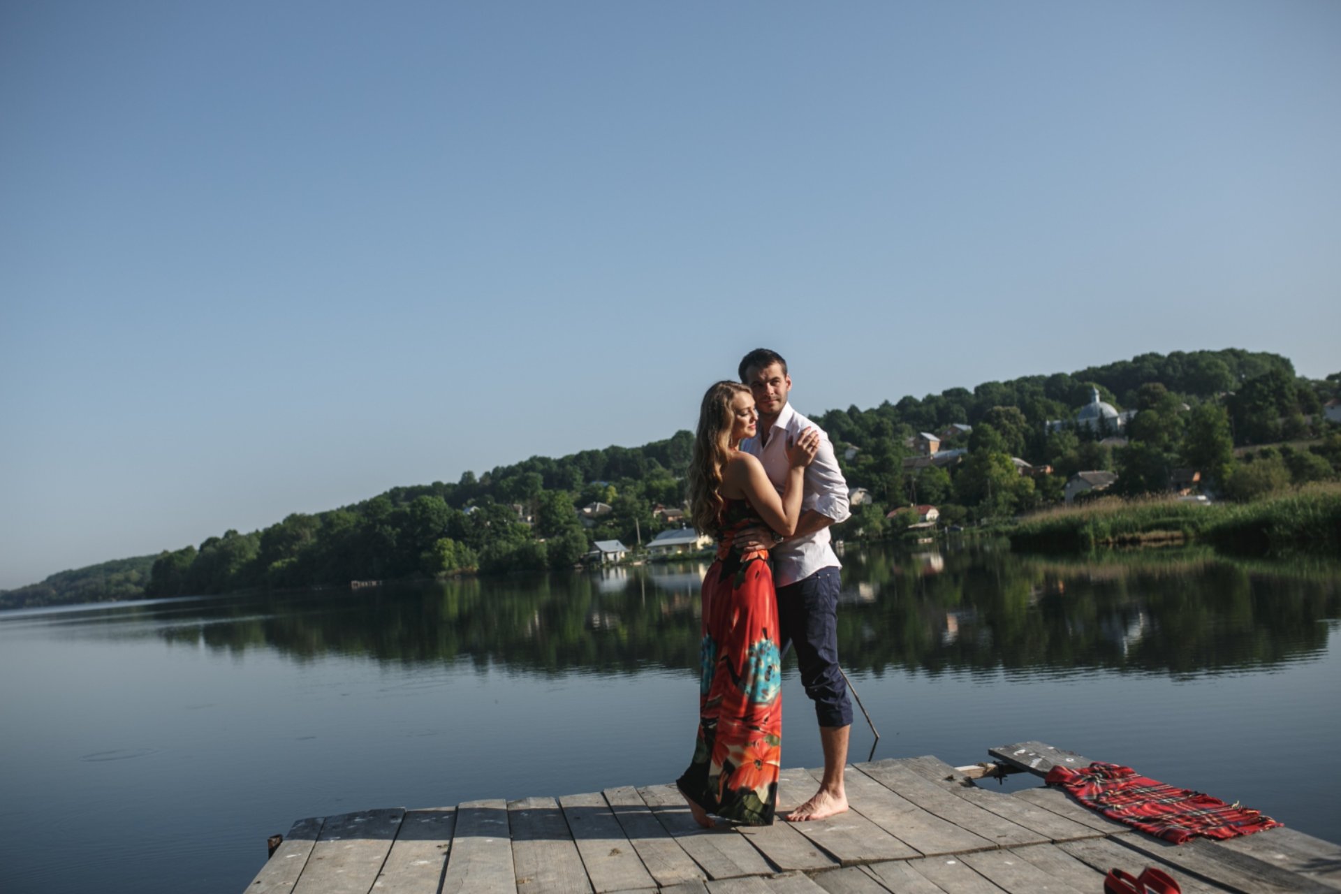 Couple embracing by a peaceful lakeside in Vietnam — best honeymoon destination to visit in June