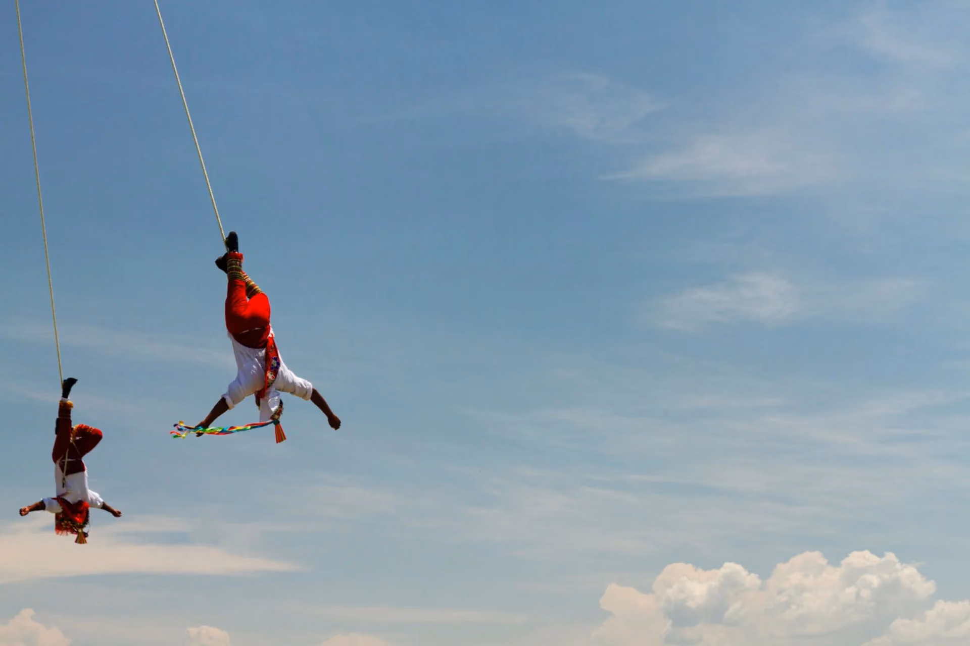 Thrill seekers bungee jumping mid-air — top adventure activity in Queenstown, New Zealand