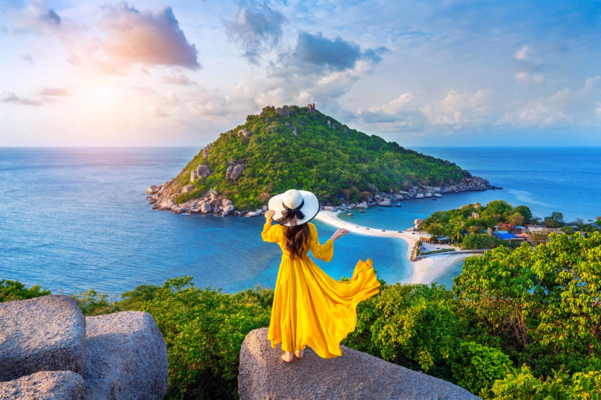 Woman overlooking a tropical island and turquoise sea in Thailand vs Vietnam travel comparison