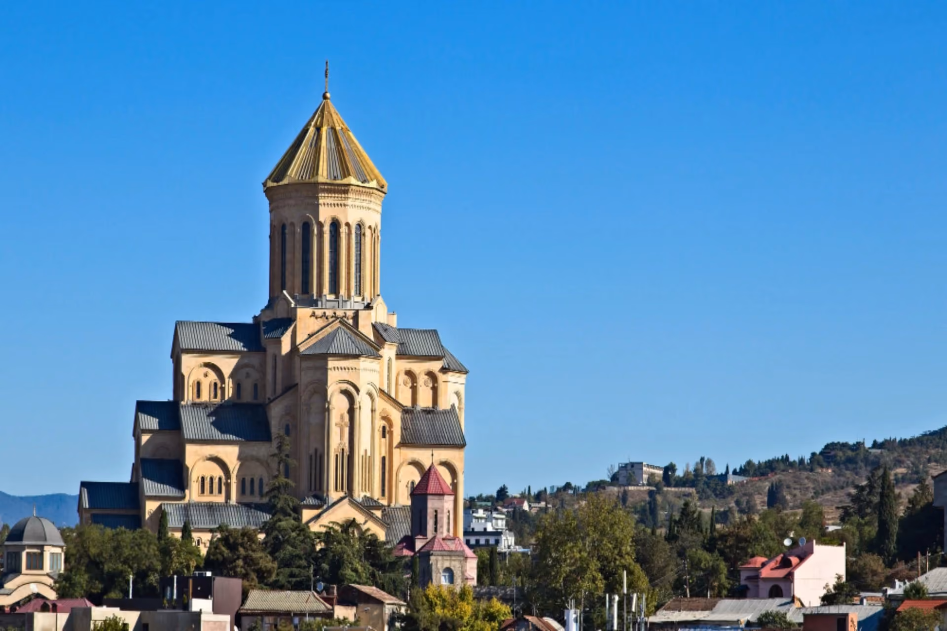 Holy Trinity Cathedral (Sameba Cathedral) in Tbilisi, Georgia, under clear November skies, showcasing one of the country's most famous landmarks.