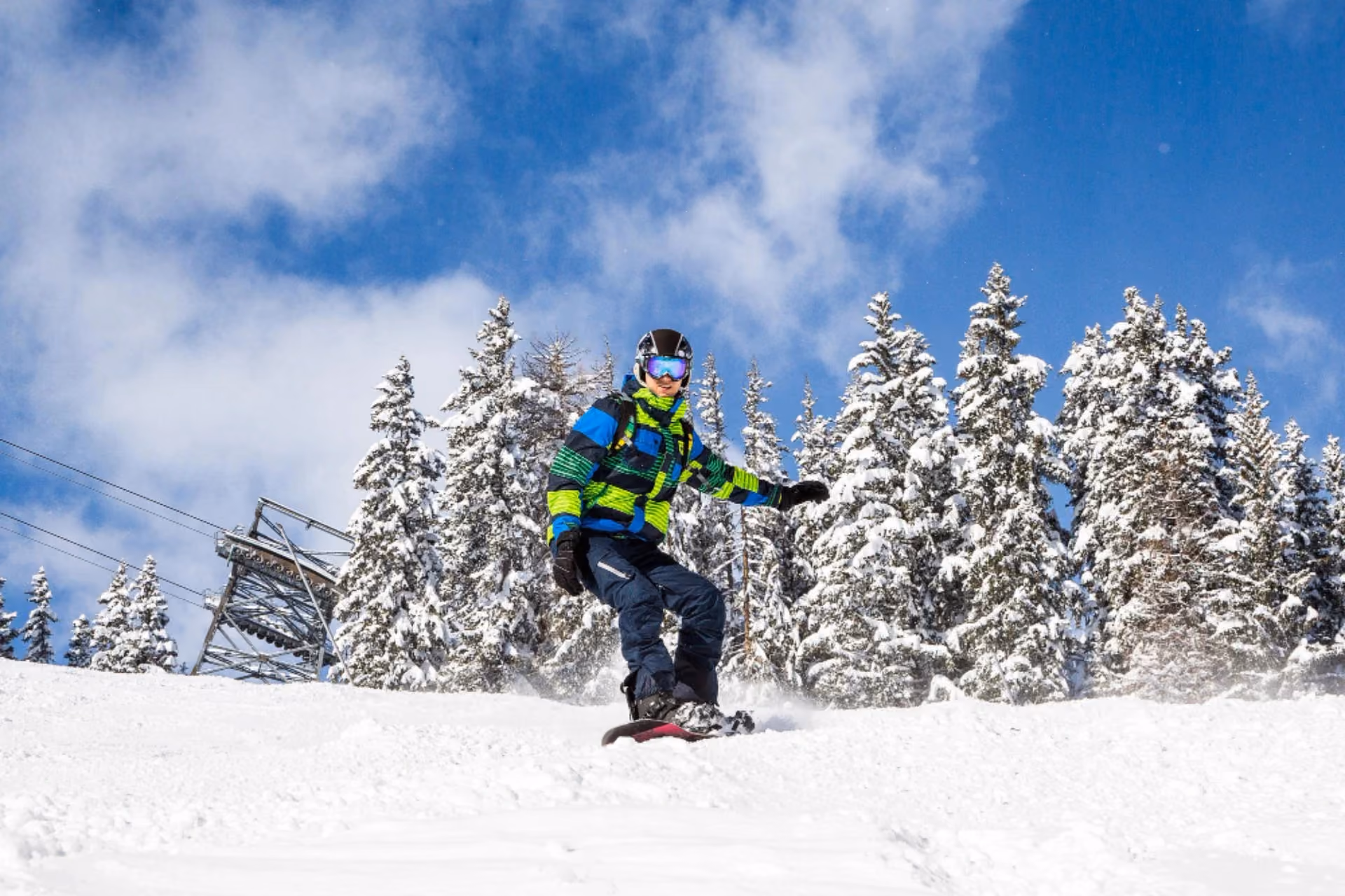 Snowboarder enjoying winter slopes in New Zealand in June