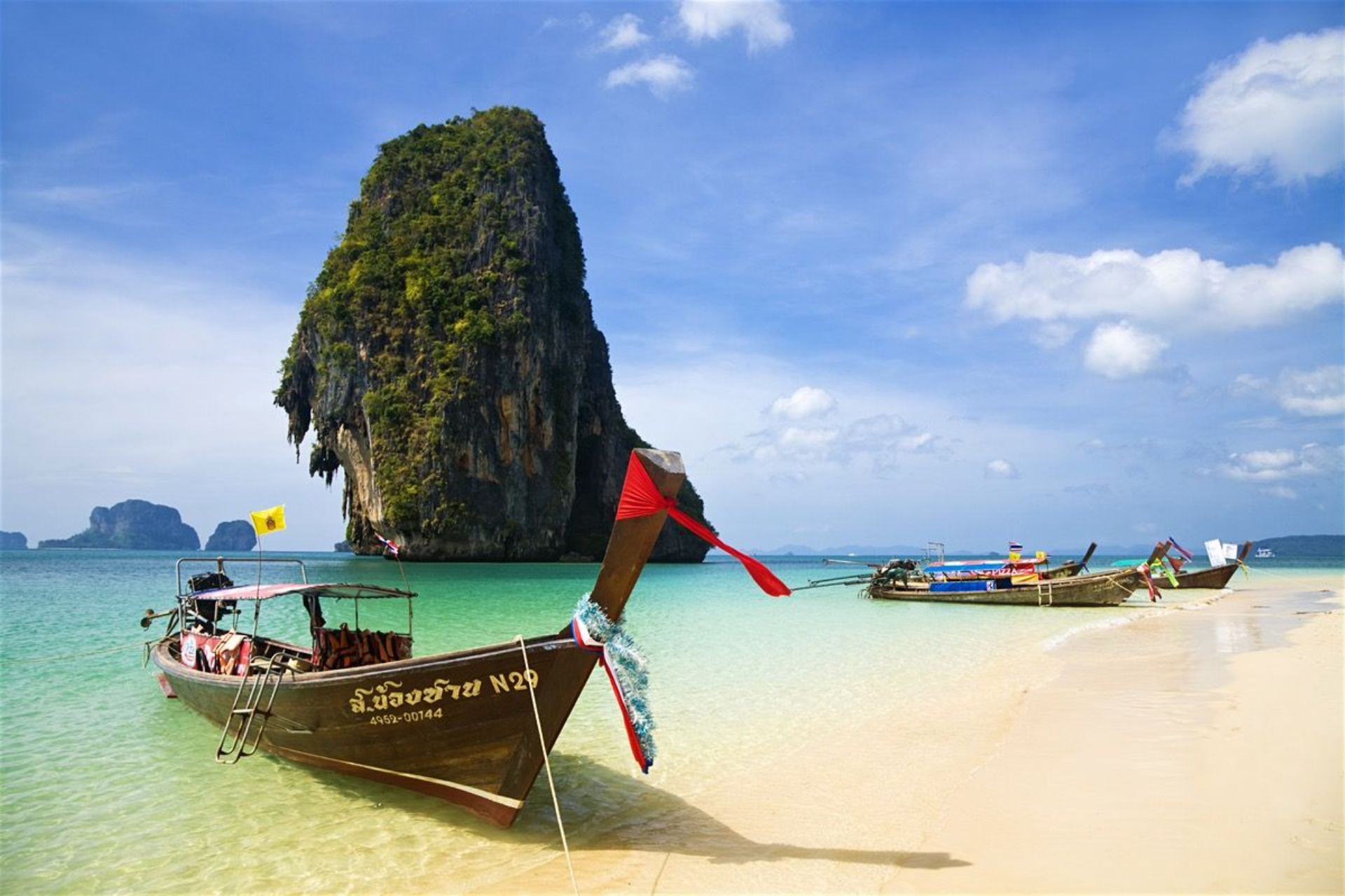 Long-tail boats on a Thailand beach in September