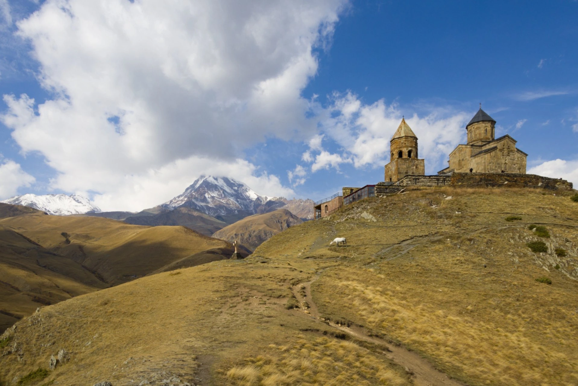 Gergeti Trinity Church in Kazbegi, Georgia, overlooking the Caucasus Mountains, one of the country's most iconic landmarks for scenic views and sightseeing.