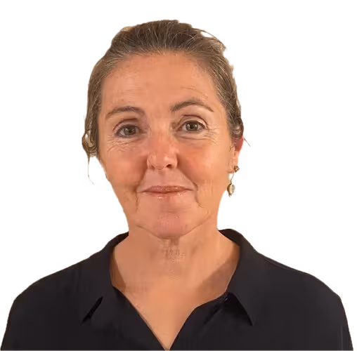 Portrait of a middle-aged woman with light skin and light brown hair pulled back, wearing a black collared shirt and pearl earrings.