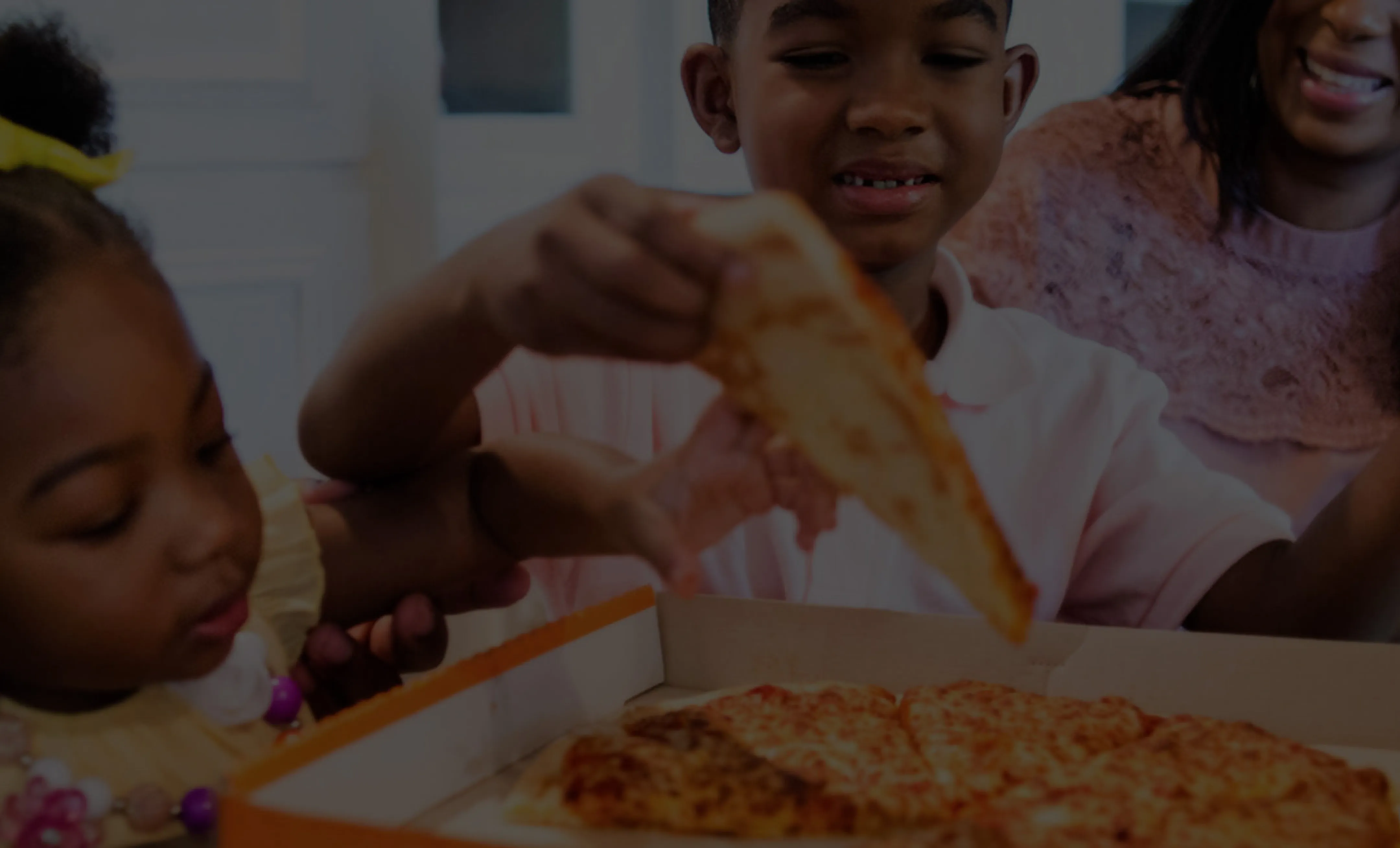 Family sharing Little Caesars pizza