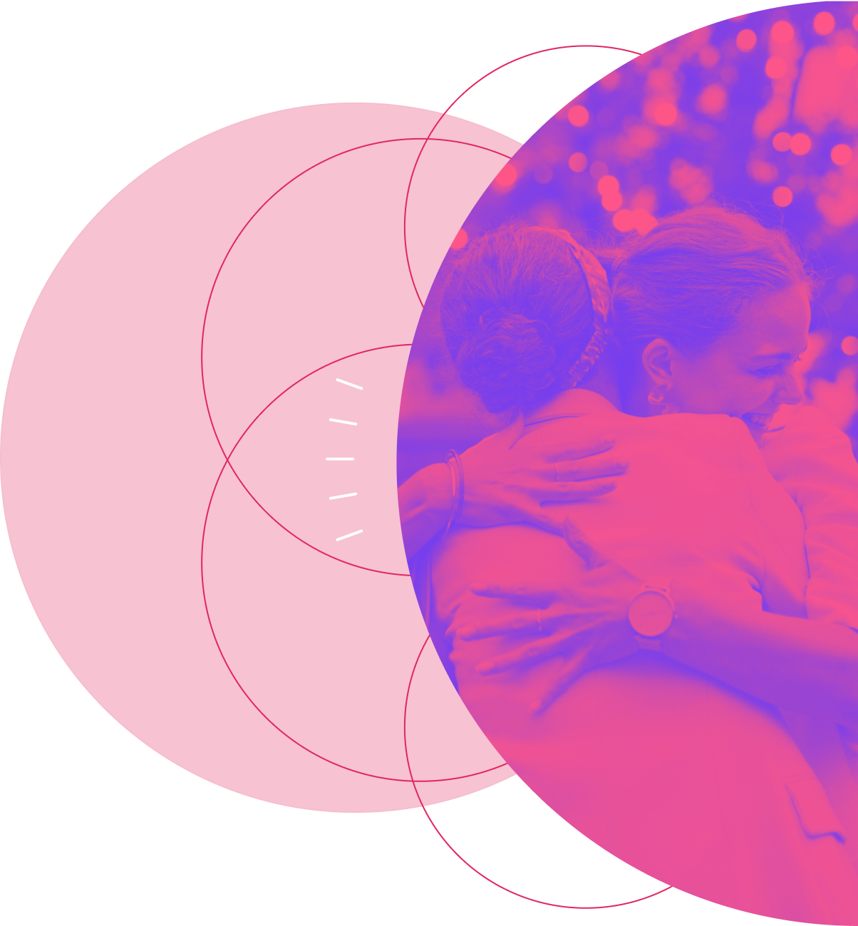 Two women smiling and hugging