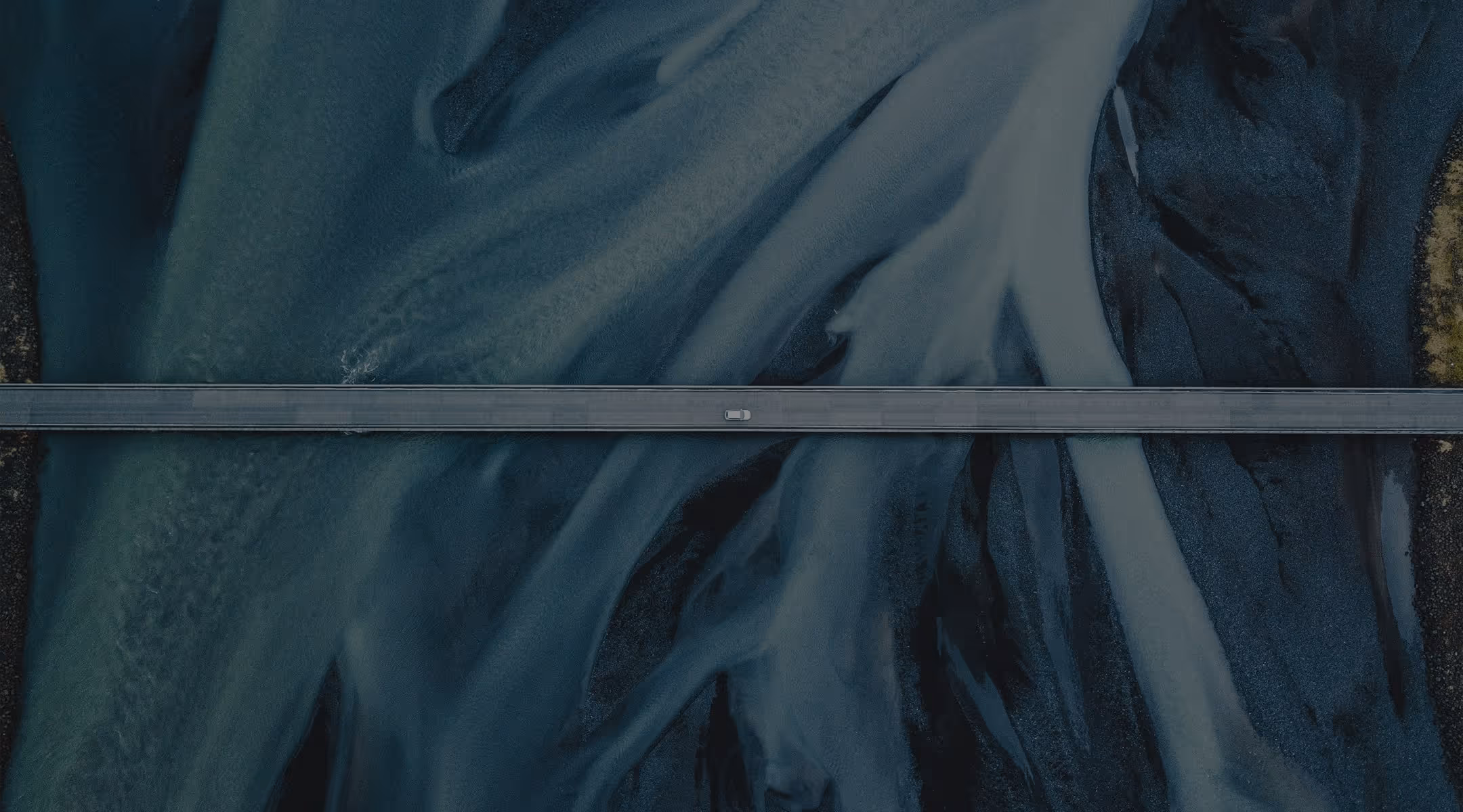 An aerial view of a road with blue fabric.