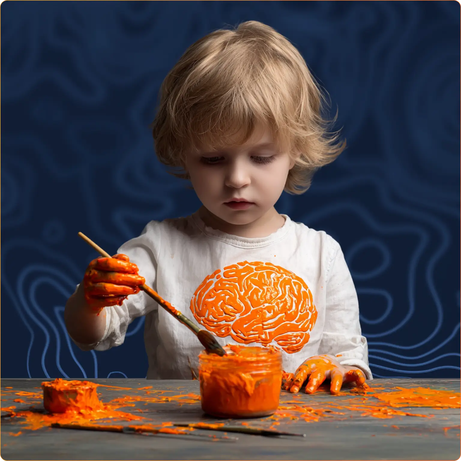 A young child paints with bright orange, wearing a shirt with a brain design—capturing the joy behind Mission:Brain’s arts and crafts day for pediatric patients in Guadalajara.