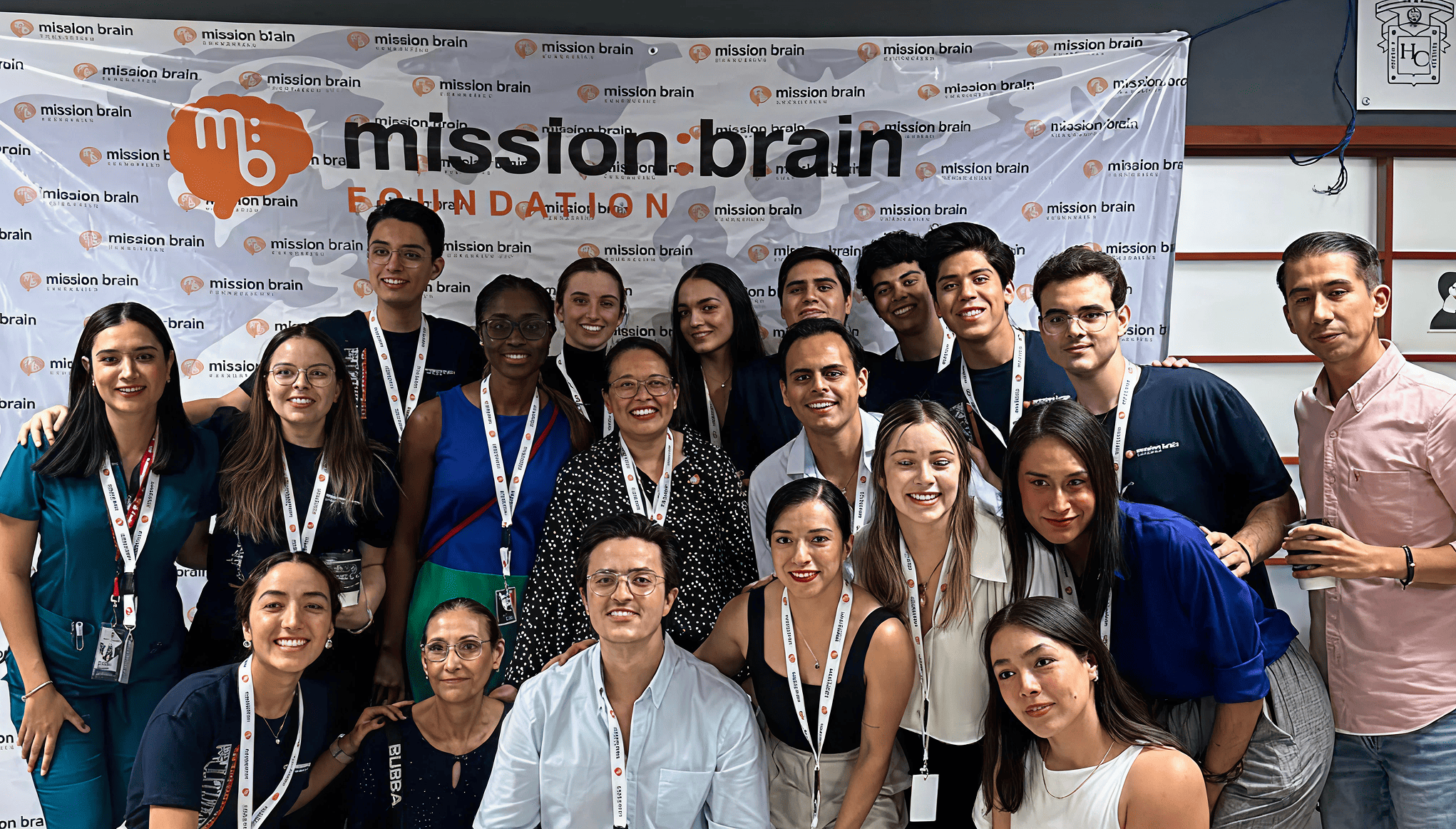 Mission:Brain volunteers and leaders gather for a group photo in front of a branded backdrop—celebrating unity, purpose, and the collective impact of the Guadalajara mission.