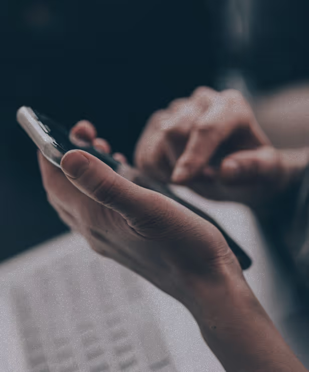 Man typing on a phone