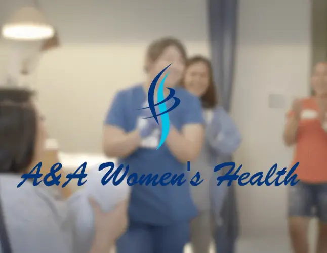 A&A Women’s Health logo over a blurred group of women in a clinic