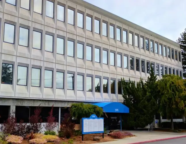 Exterior of a medical office building with a blue entrance