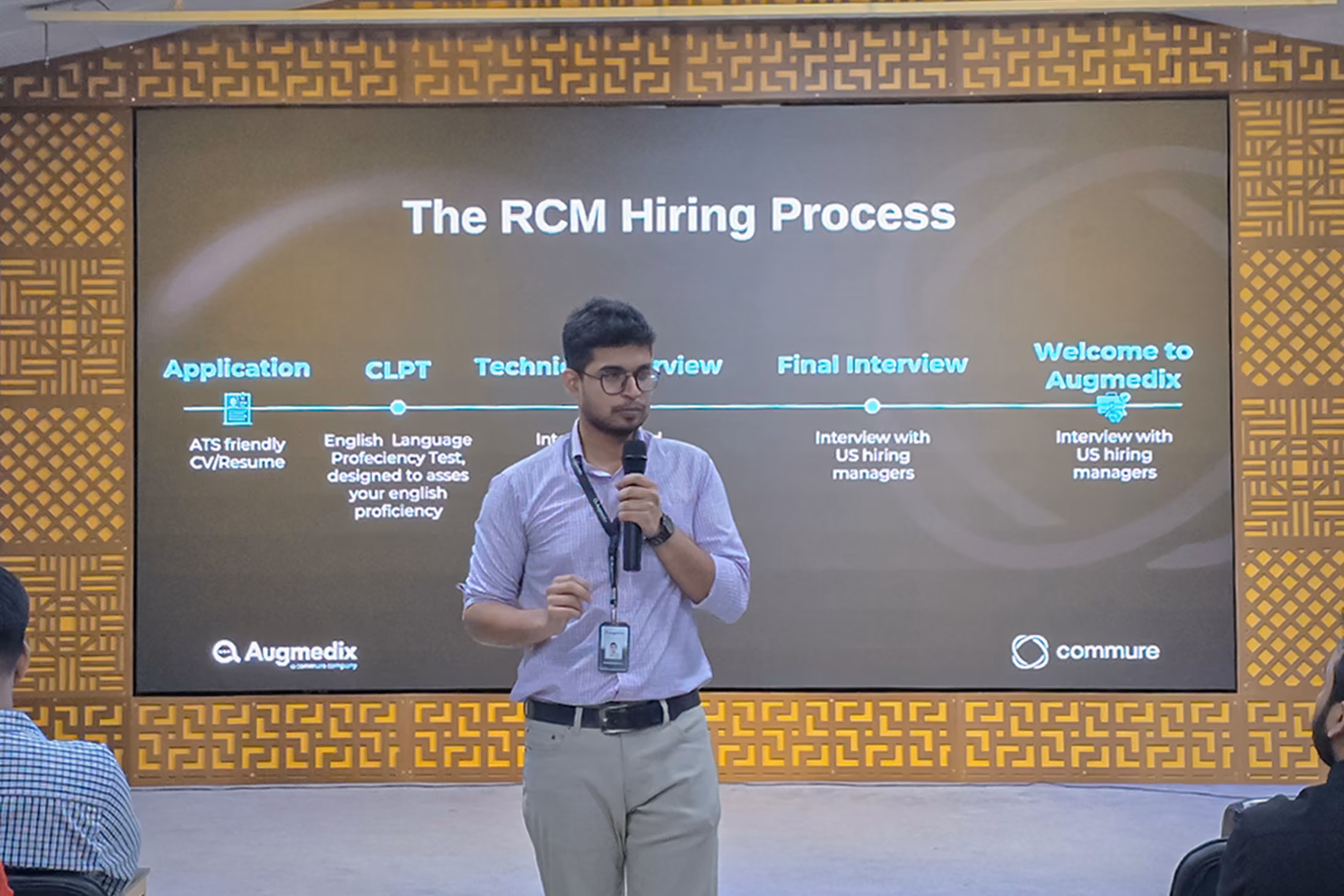 Person giving a presentation about the hiring process during a recruitment workshop.