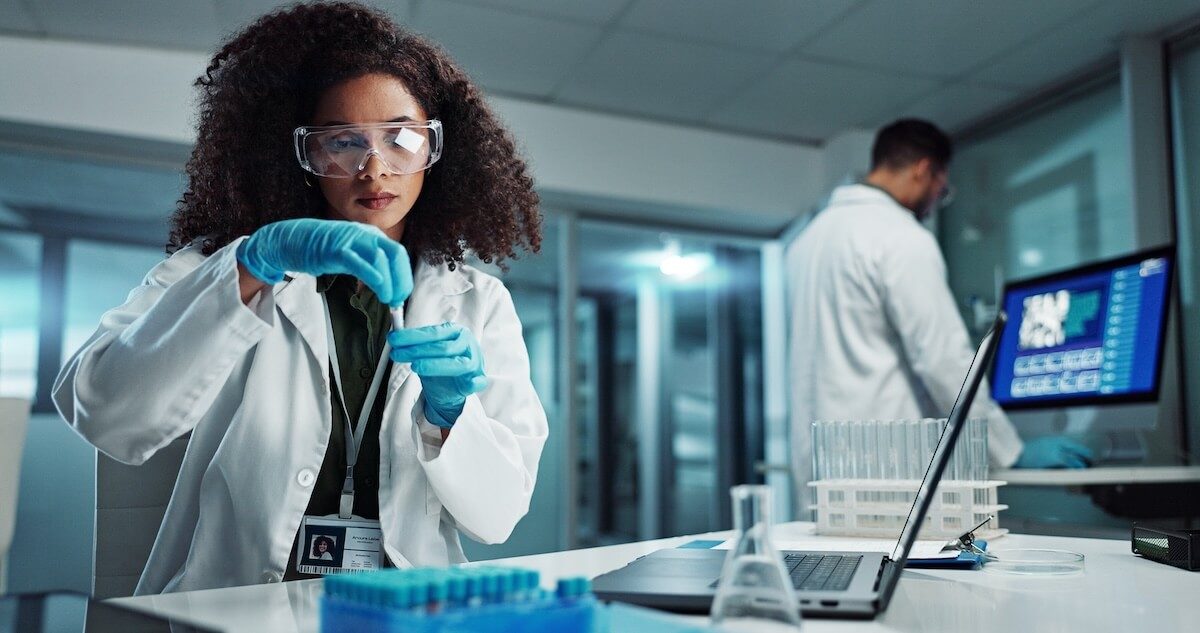 clinician working in lab with lab samples