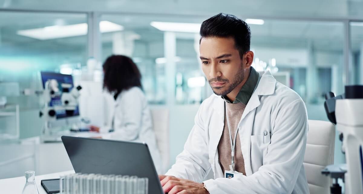 clinician typing on computer